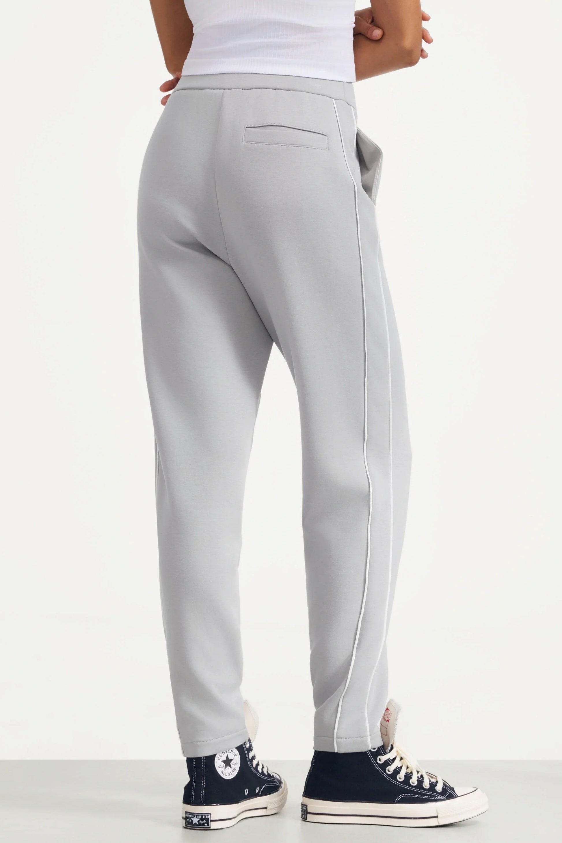 Back view of women's Soft Cloud Grey slim fit golf pants with a welt back pocket