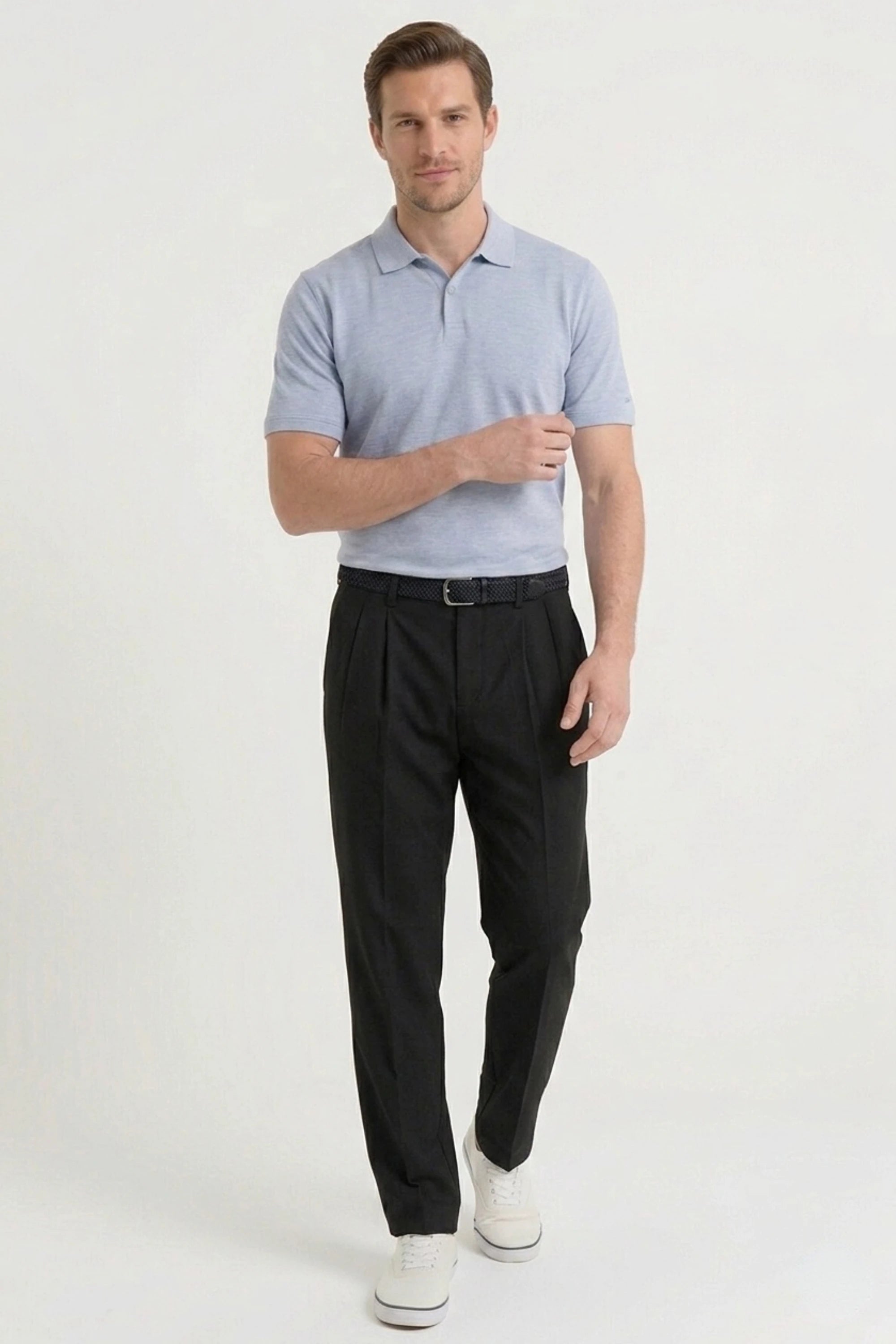 Men’s midnight black golf pants with a tapered silhouette and polished tailored style for golf and everyday wear