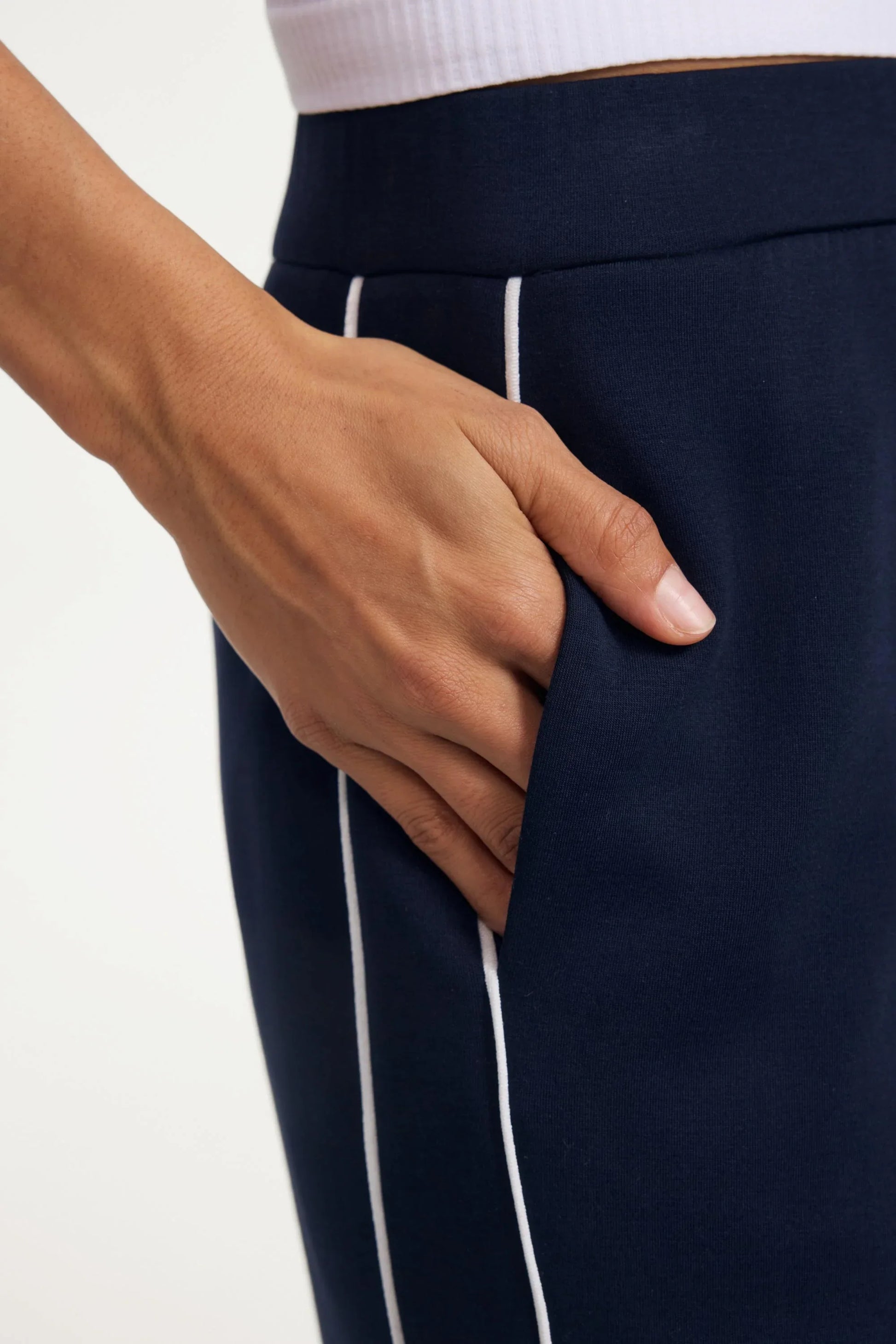 Close-up of the side pocket detail on Midnight Navy track pants