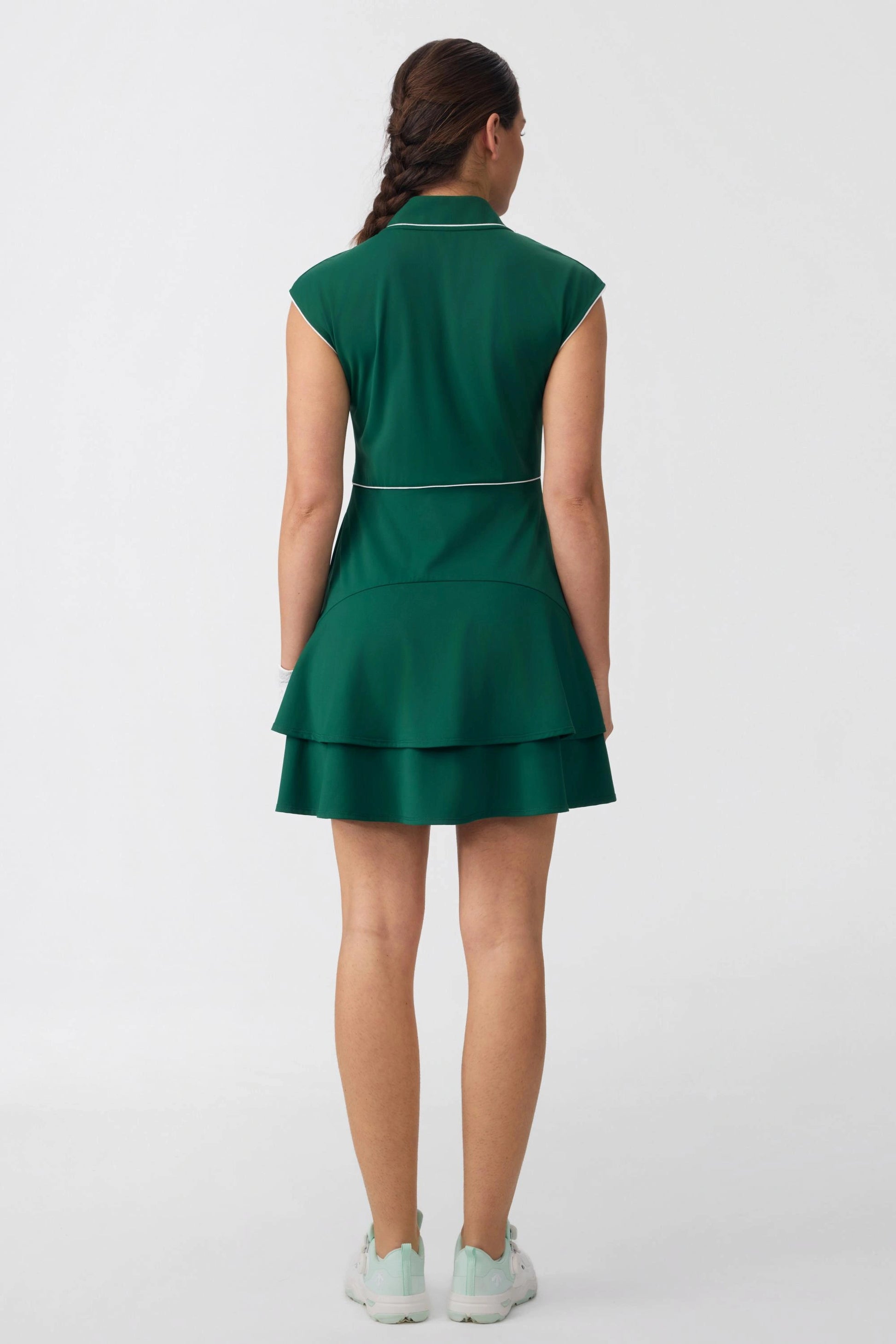 Full back view of women's zip-front golf dress in pine green