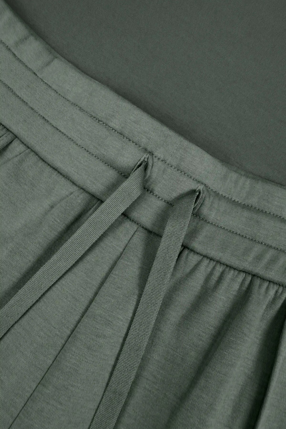 Close-up of Sage Grey Sculpt Drawstring Jogger Pants highlighting the adjustable drawstring waistband