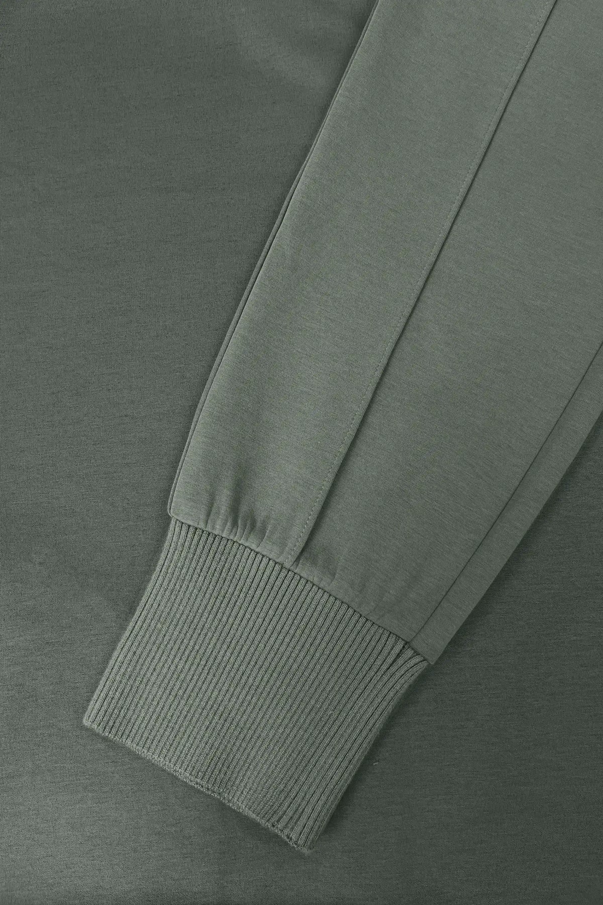 Close-up of Sage Grey Sculpt Drawstring Jogger Pants showing the ribbed ankle cuff detail