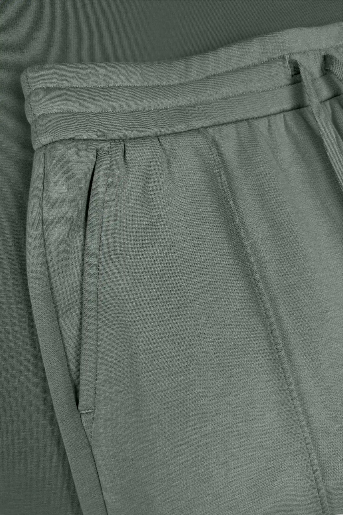 Close-up of Sage Grey Sculpt Drawstring Jogger Pants highlighting the side pocket and waistband construction
