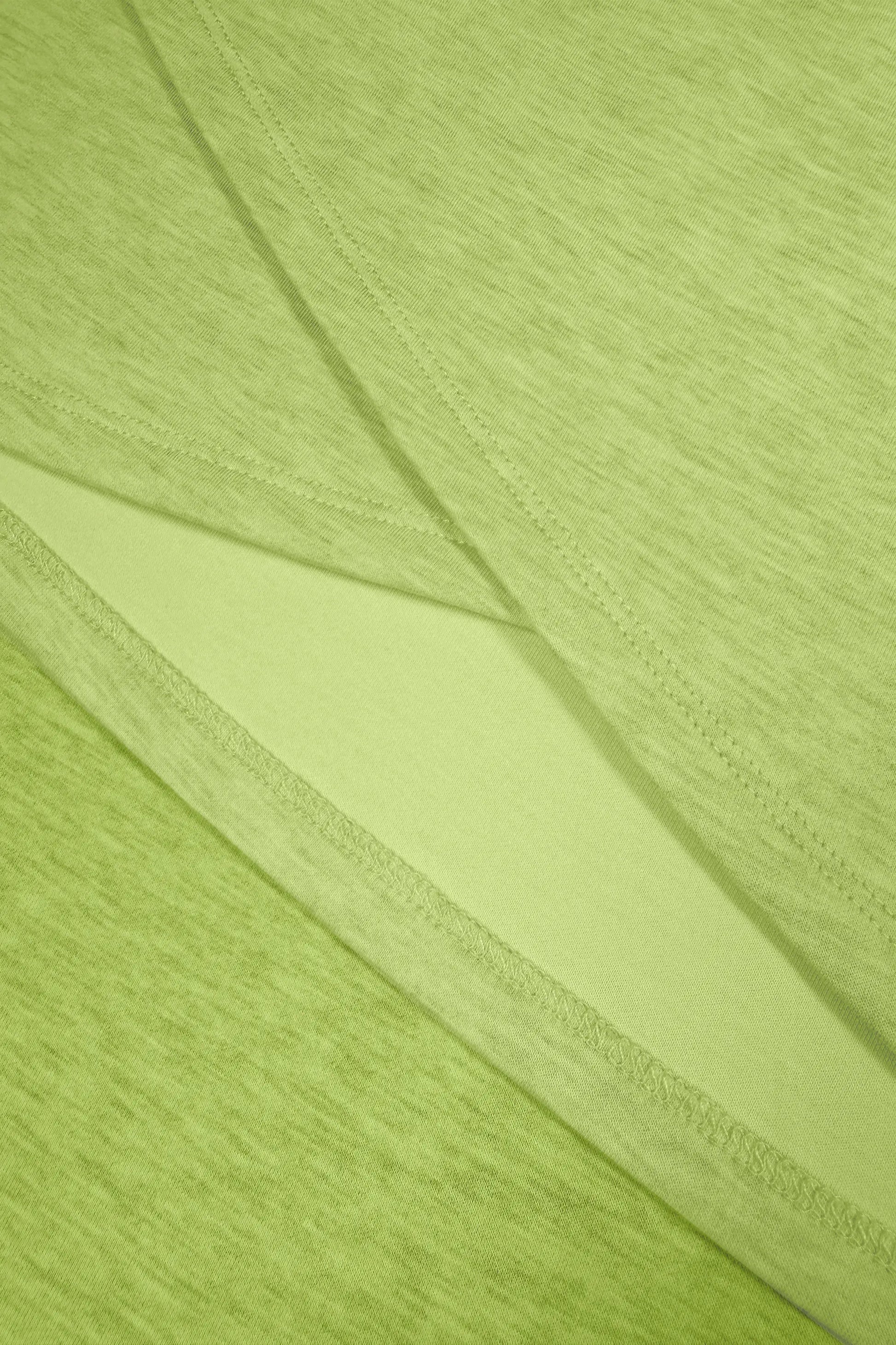Close-up of lime Sculpt Wrap Golf Skort highlighting the overlapping wrap construction