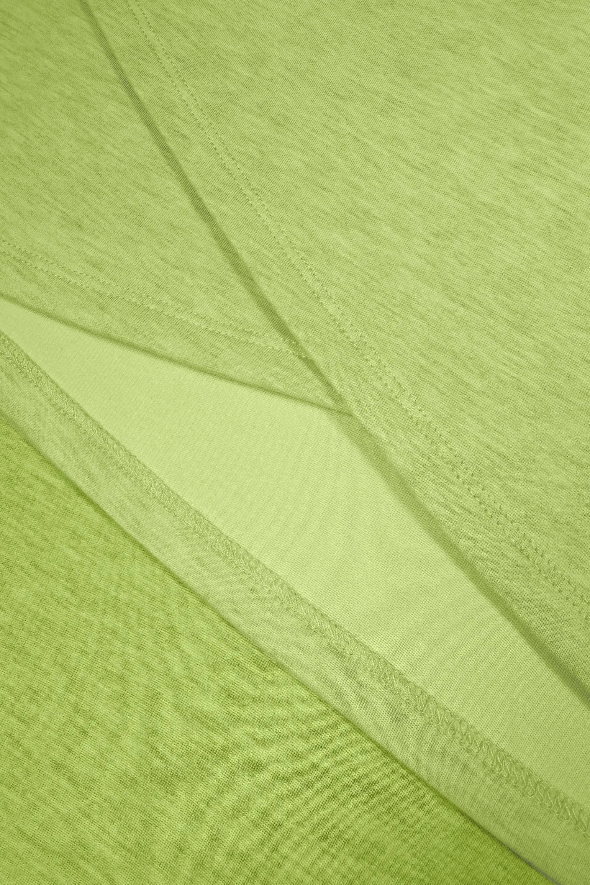 Close-up of lime Sculpt Wrap Golf Skort highlighting the overlapping wrap construction