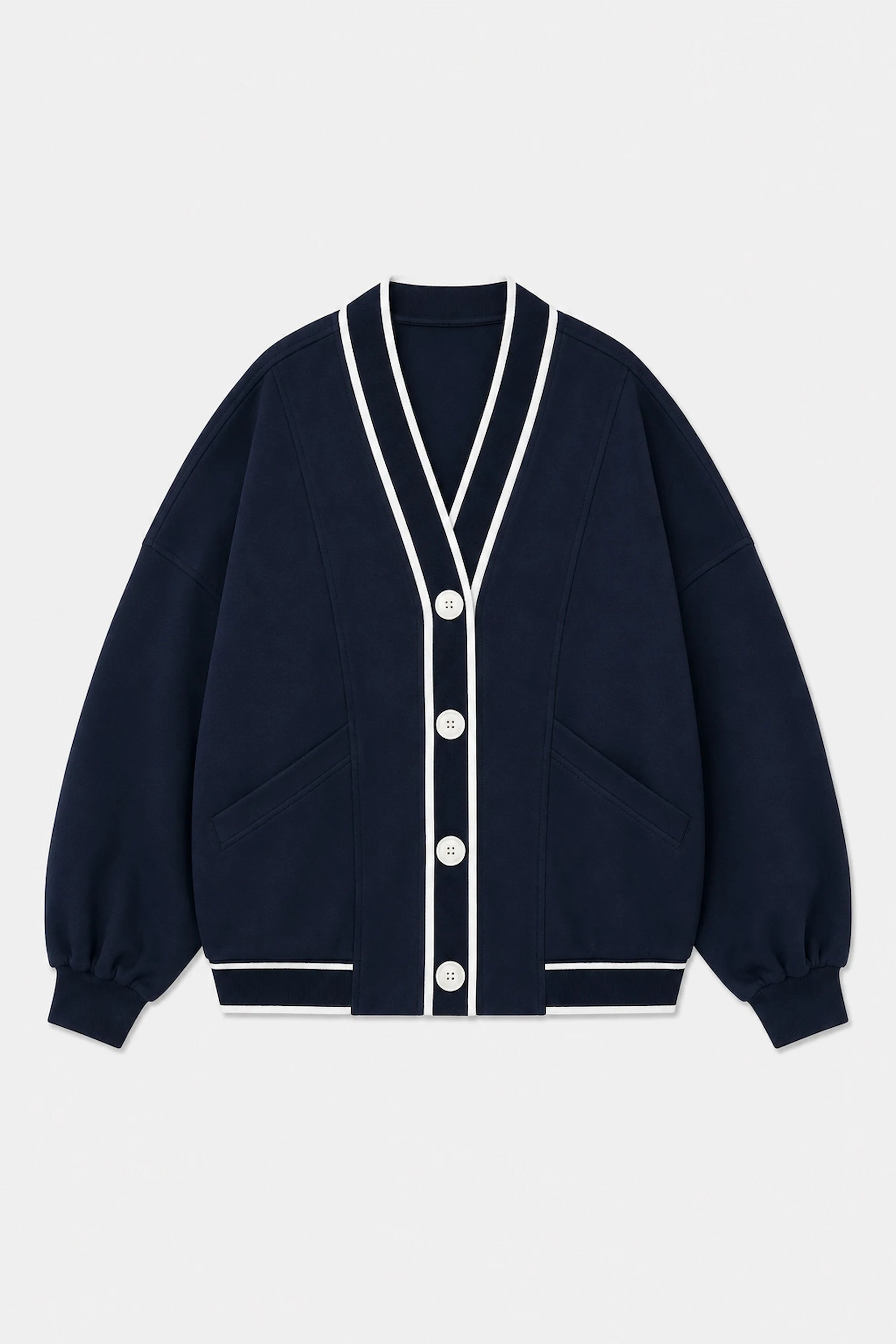 Front flat lay of Tailored Sports Cardigan in Midnight Navy featuring contrast white trim, button front, and patch pockets