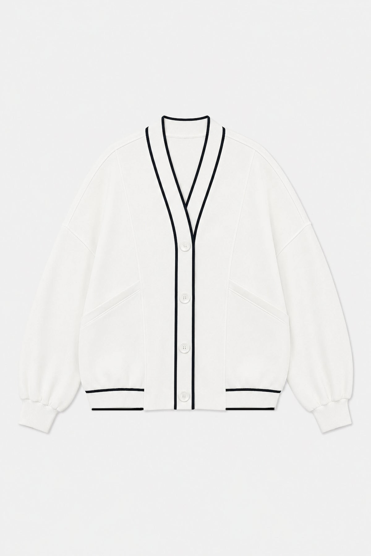 Front flat lay of Tailored Sports Cardigan in Soft Ivory featuring contrast black trim, button front, and patch pockets