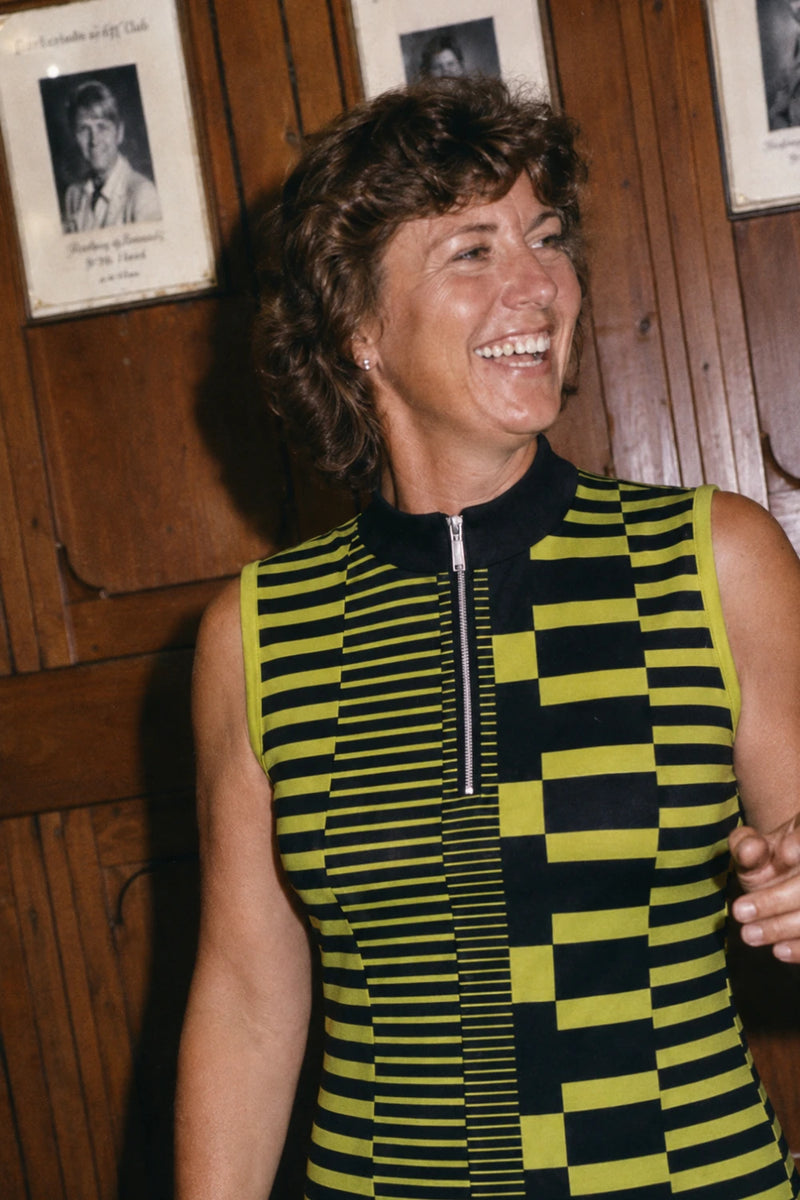 Close view of Velocity Circuit women's golf dress featuring geometric pattern and quarter zip collar detail