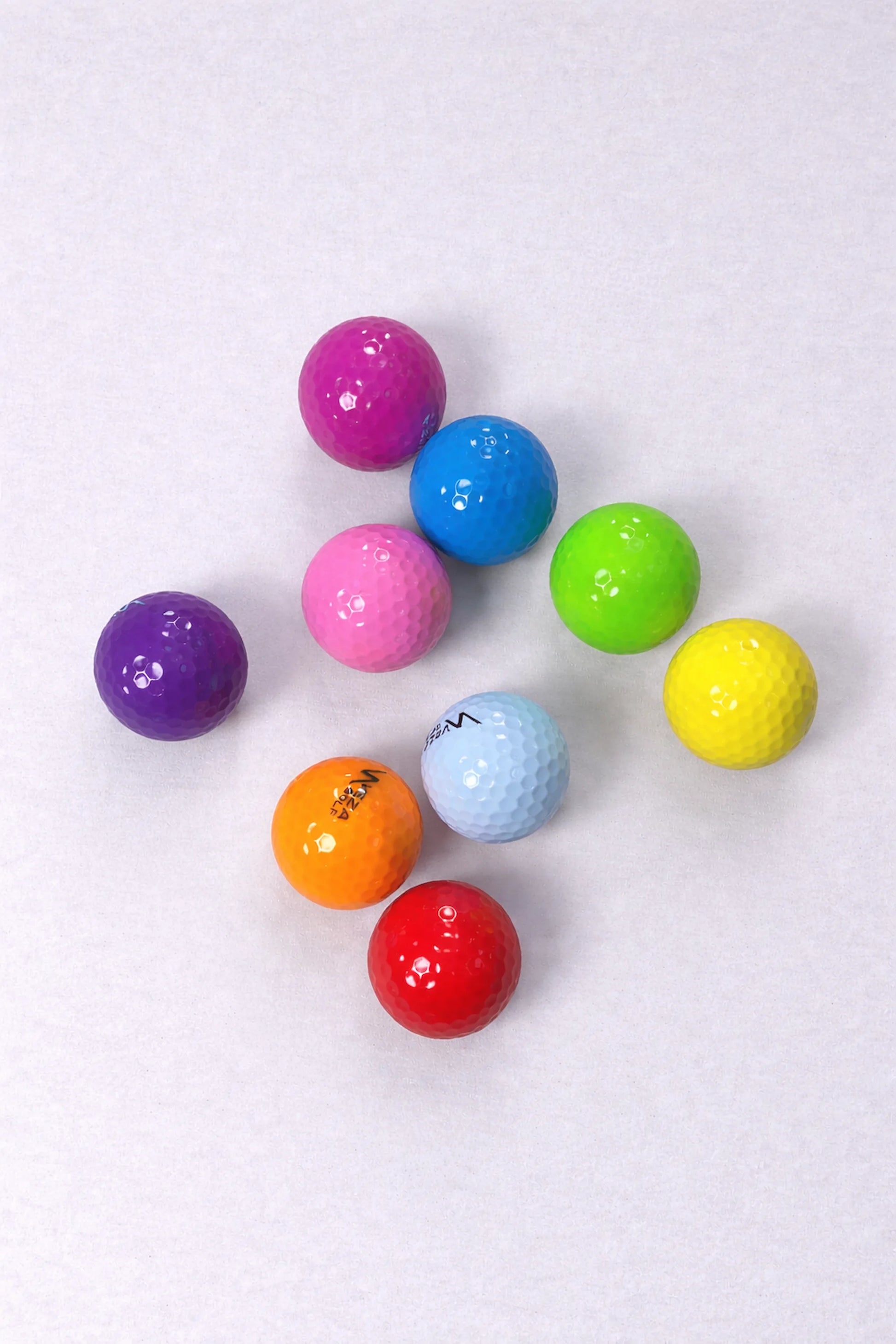 Set of VEZA colored surlyn golf balls displayed on white background