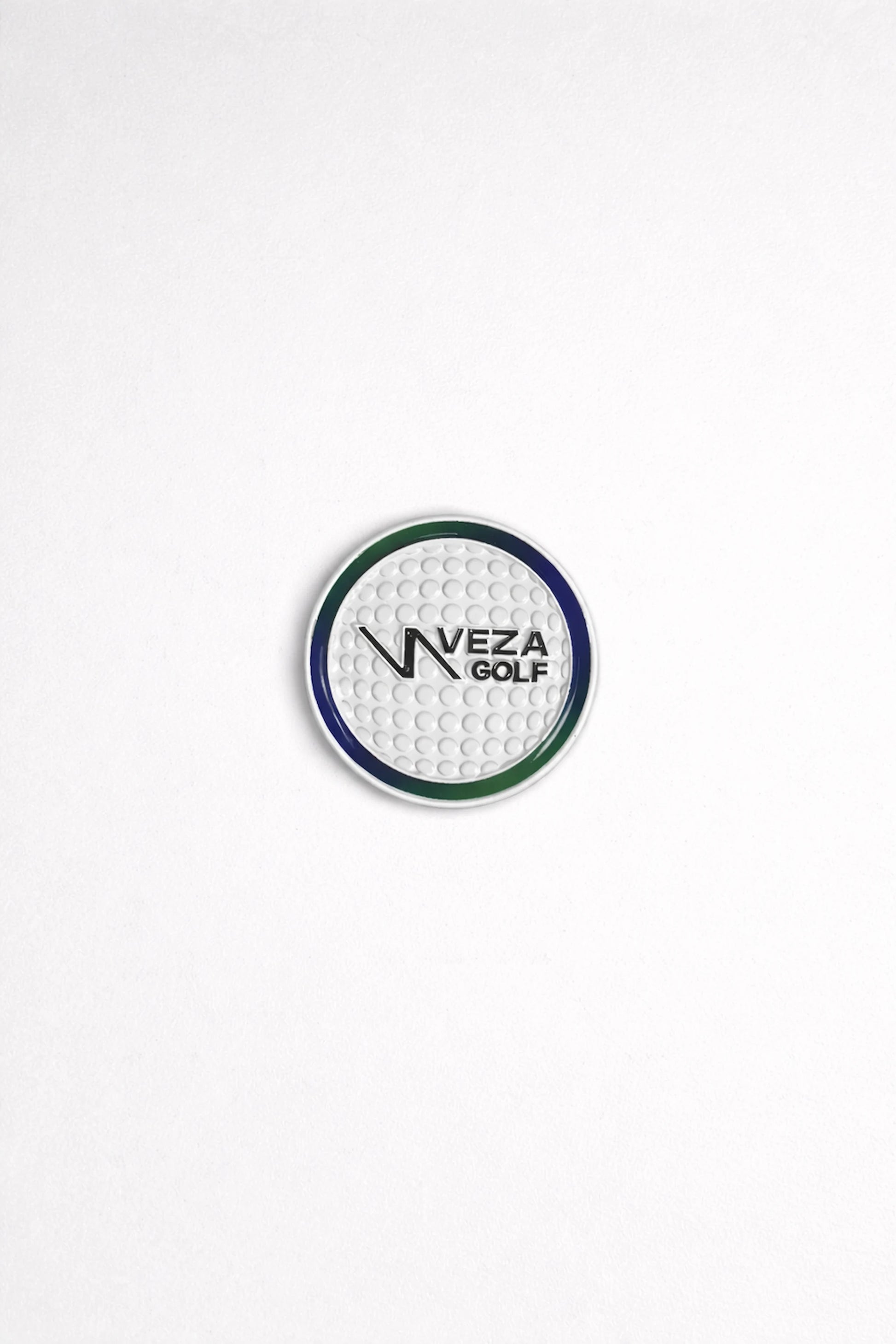 Front view of VEZA magnetic golf ball marker with textured surface