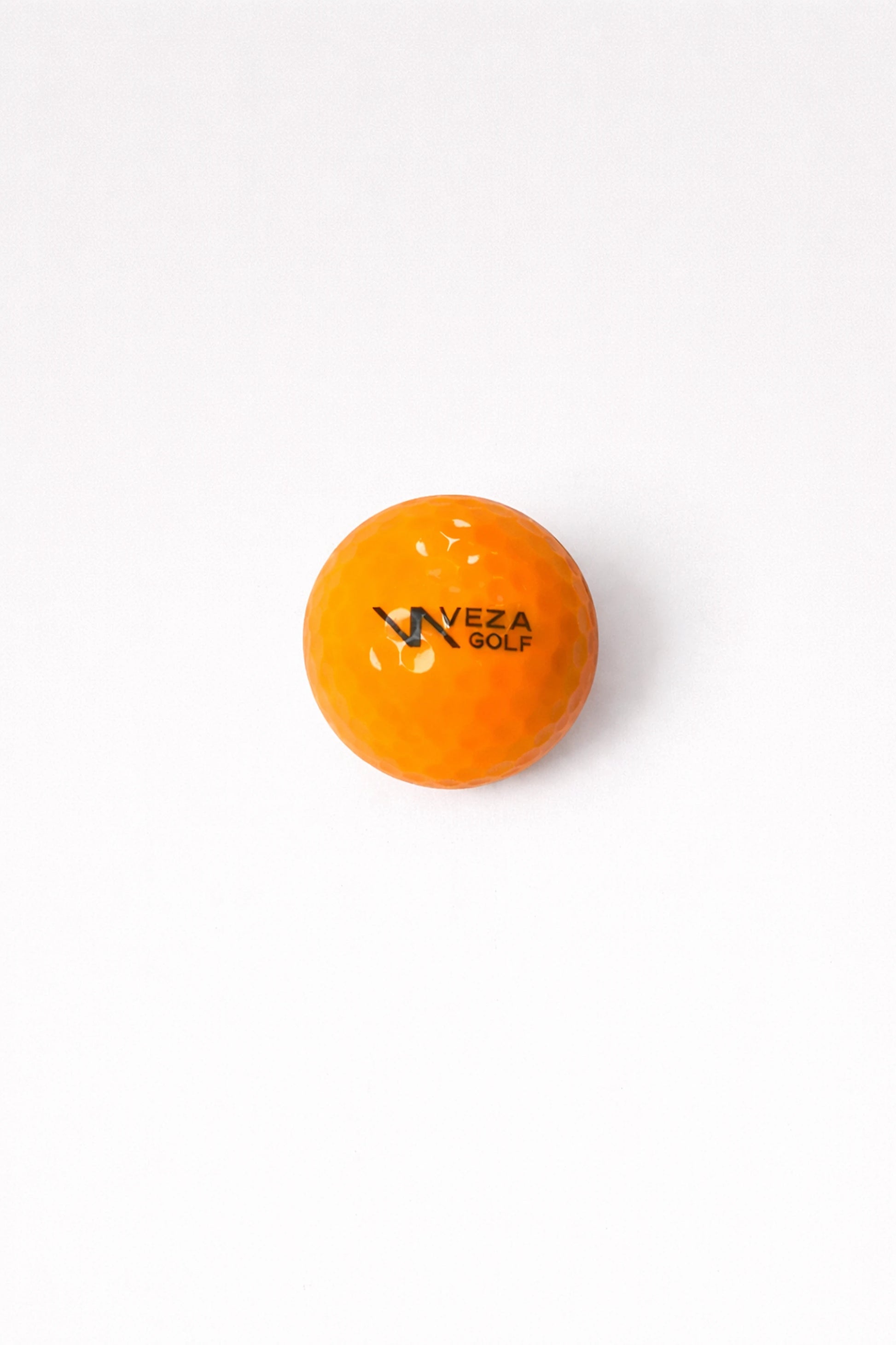 Orange VEZA surlyn golf ball with logo
