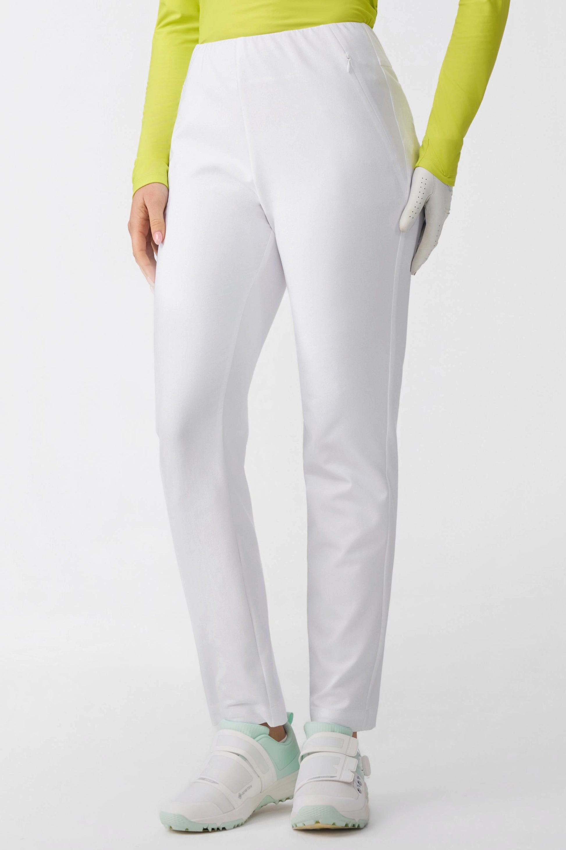 Side view of Women’s Cloudline golf pants featuring discreet zip pocket detail