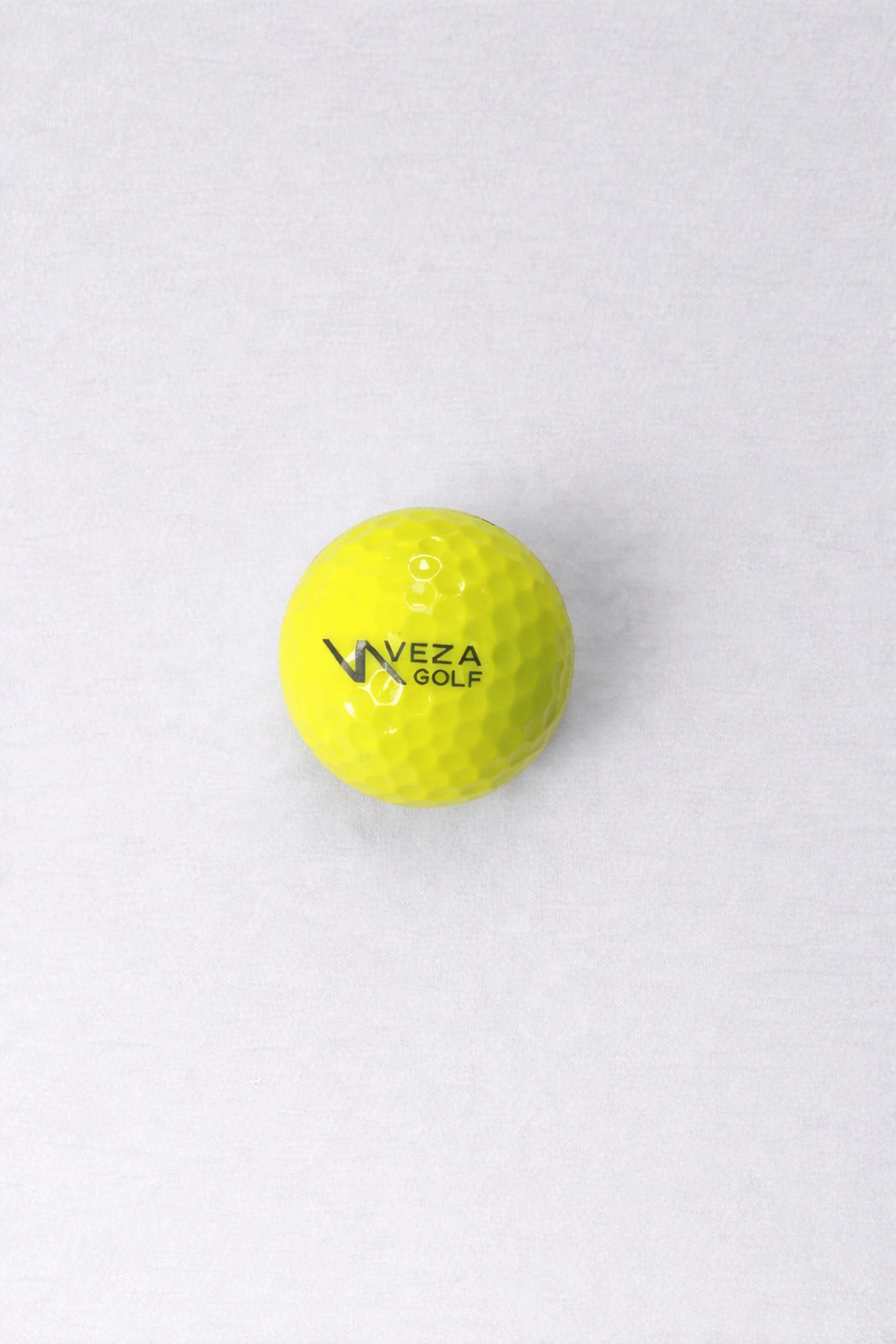 Yellow VEZA surlyn golf ball with logo