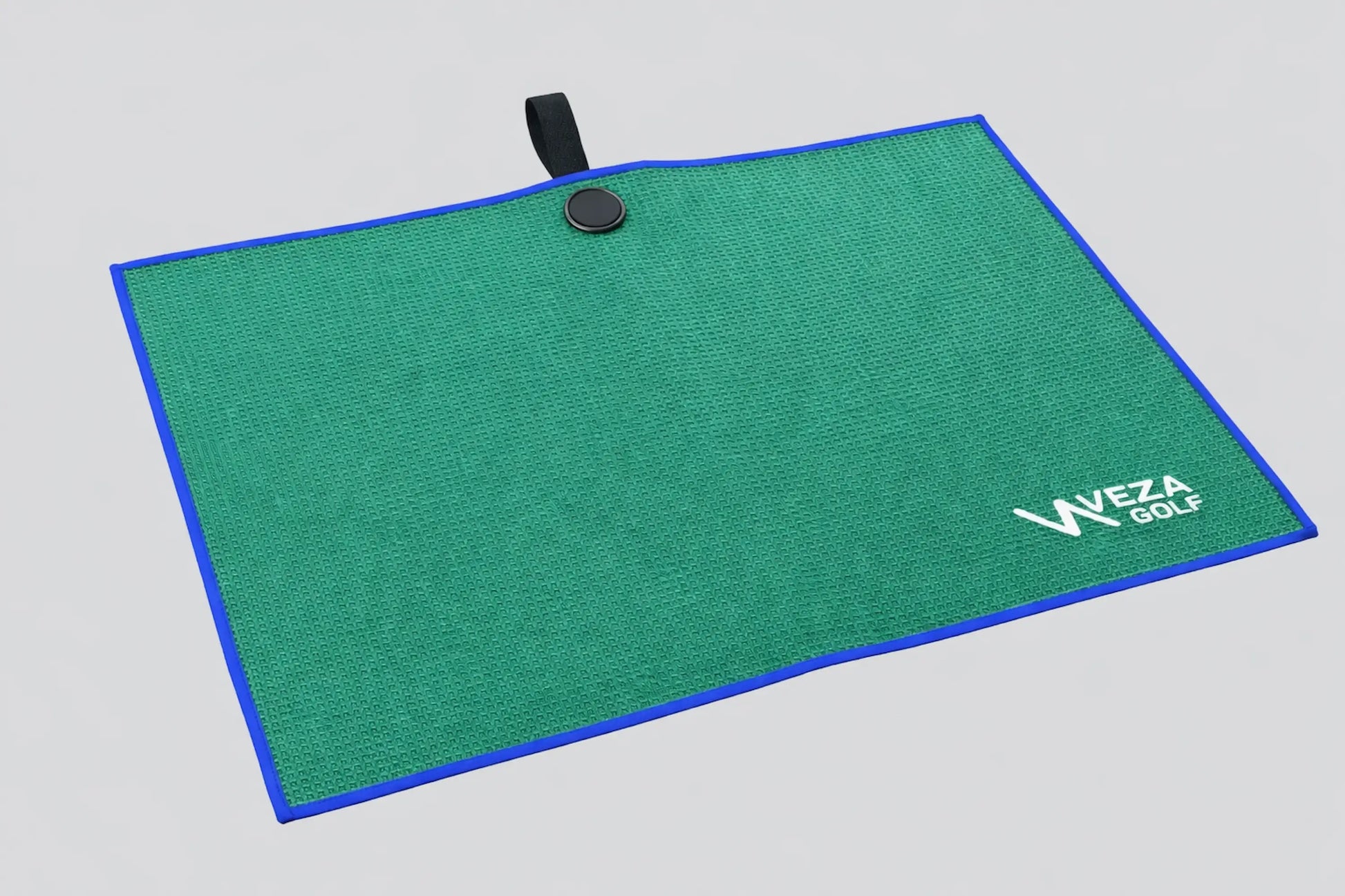 Green waffle microfiber golf towel with blue trim and VEZA Golf logo