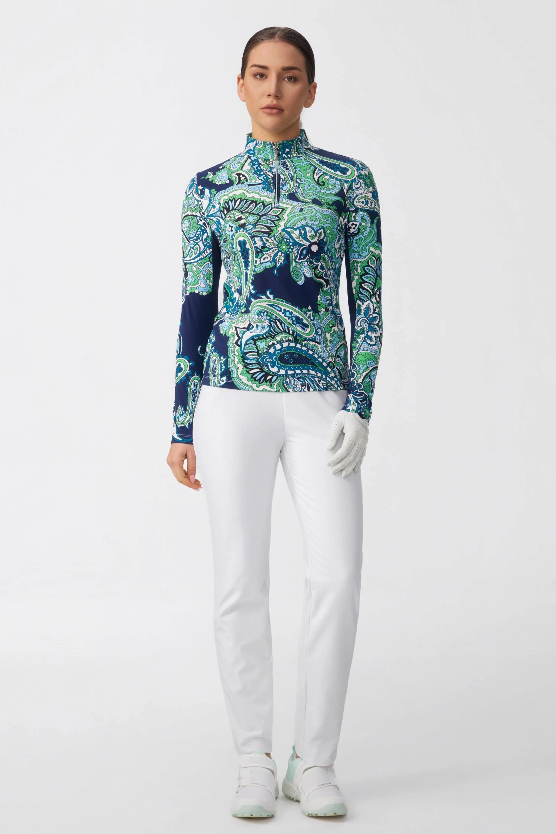 Full front look of women’s cloudline tapered golf pants styled with a long sleeve golf top