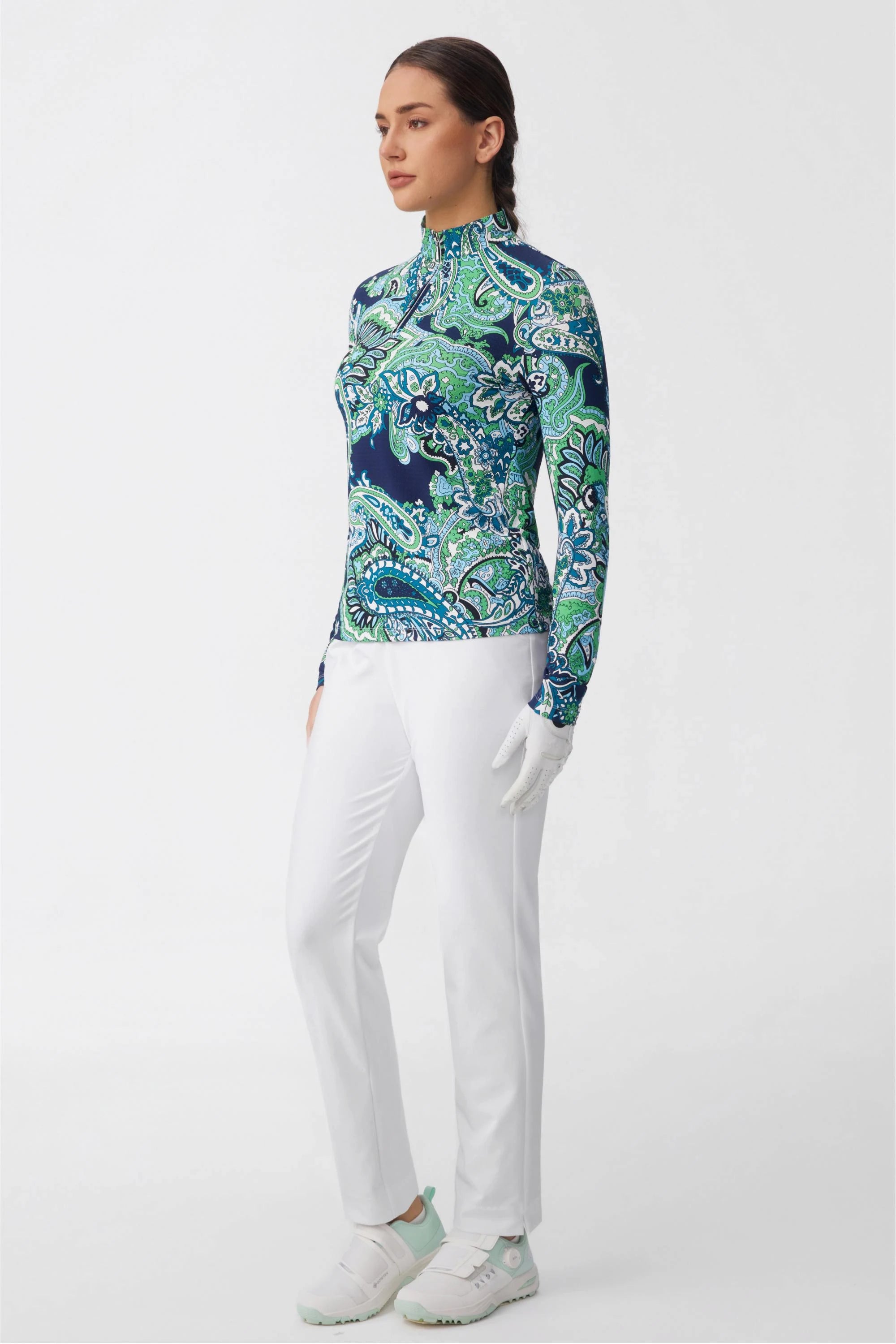 Side profile of women’s cloudline tapered golf pants styled for modern golf wear