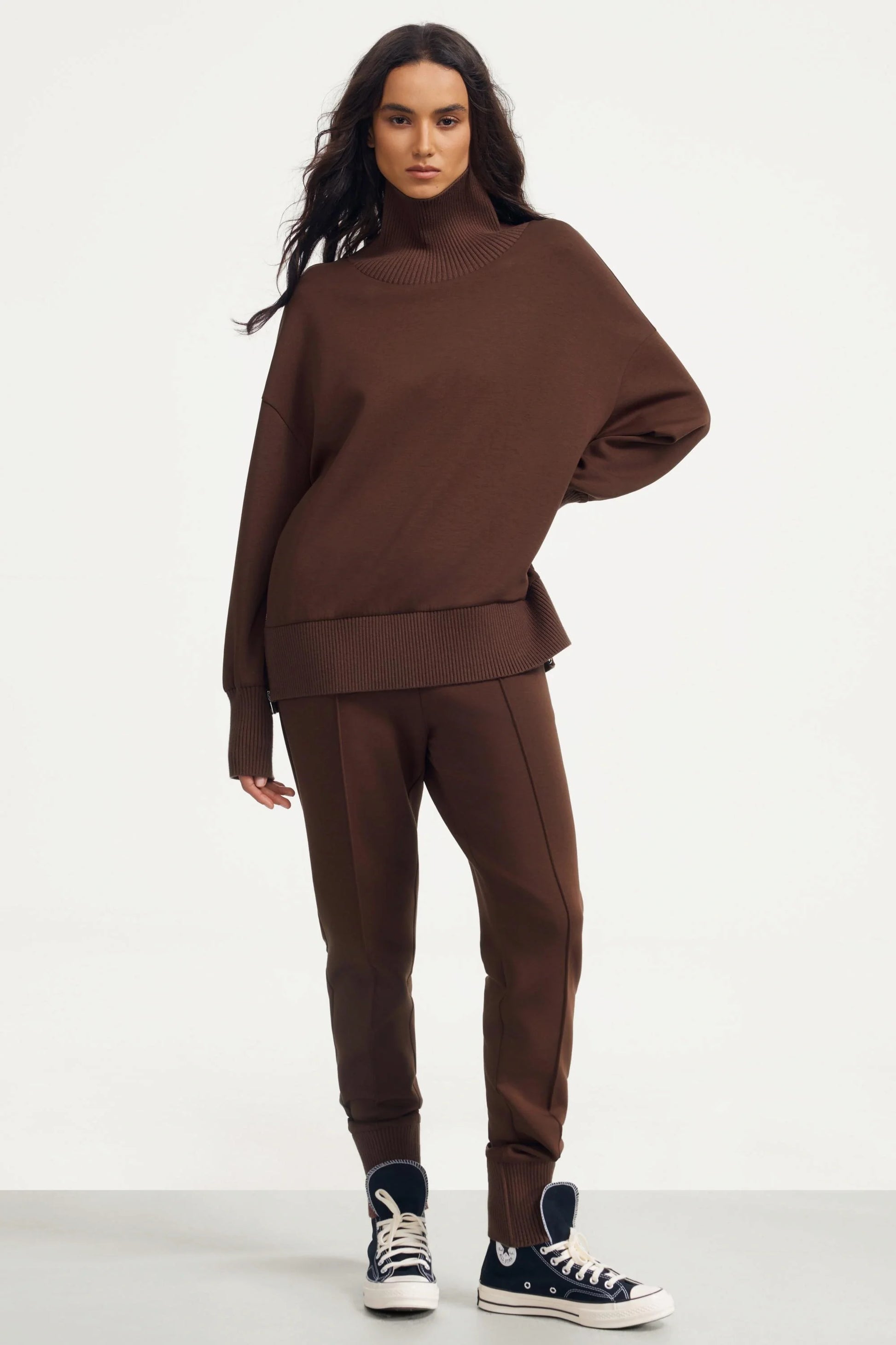 Women’s brown funnel-neck pullover in rich cocoa styled with matching fitted pants