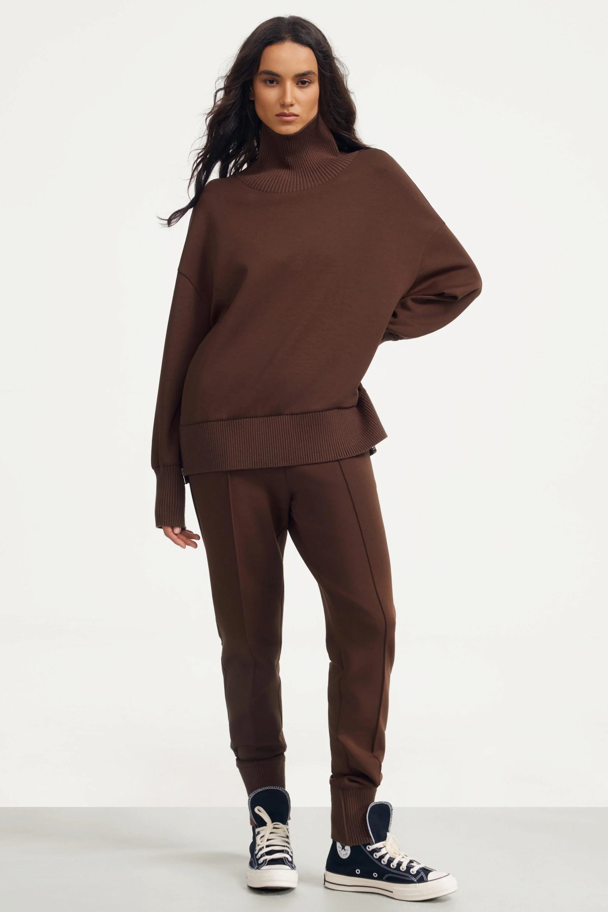 Women’s brown funnel-neck pullover in rich cocoa styled with matching fitted pants