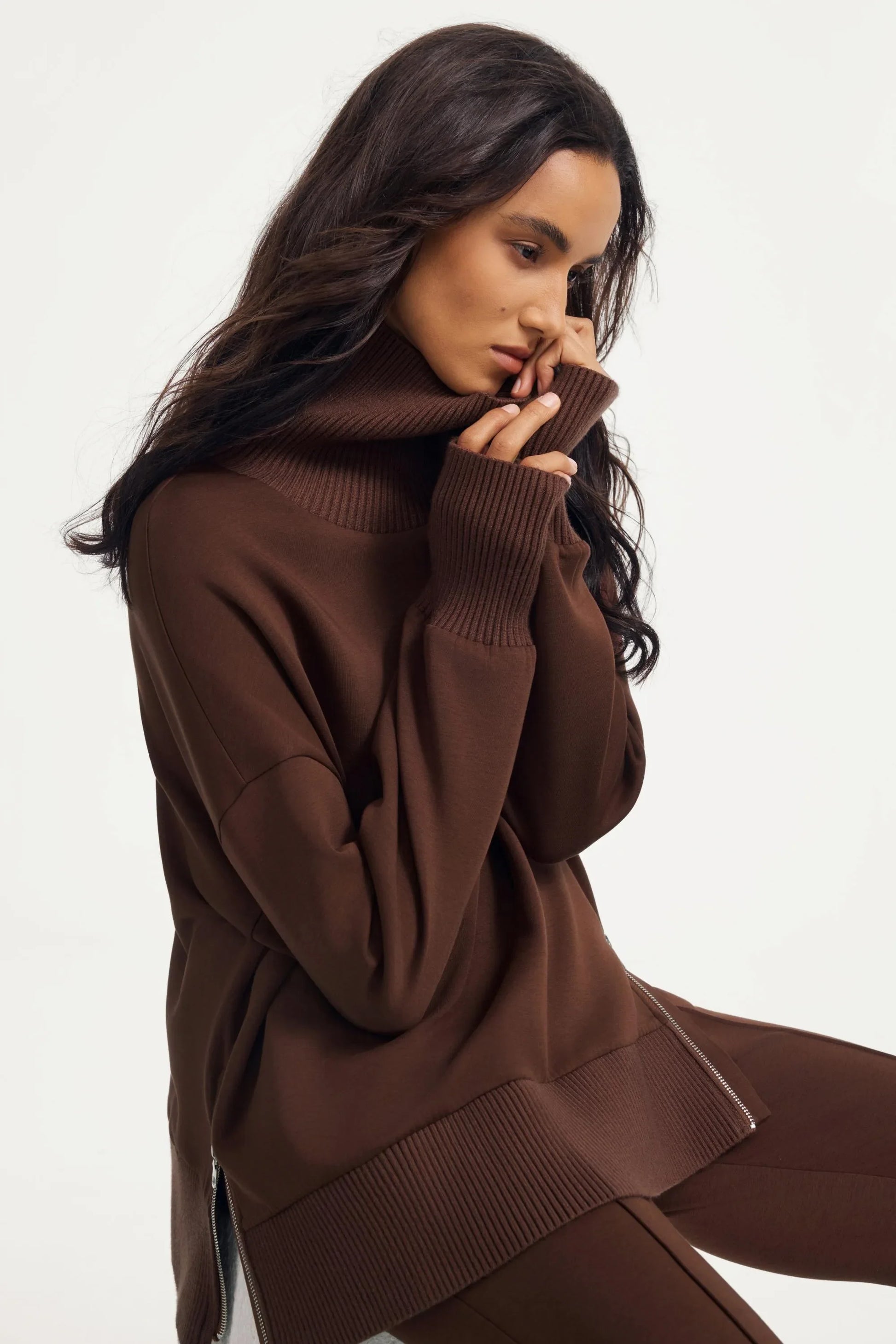 Women’s brown funnel-neck pullover with oversized fit and ribbed cuff detailing