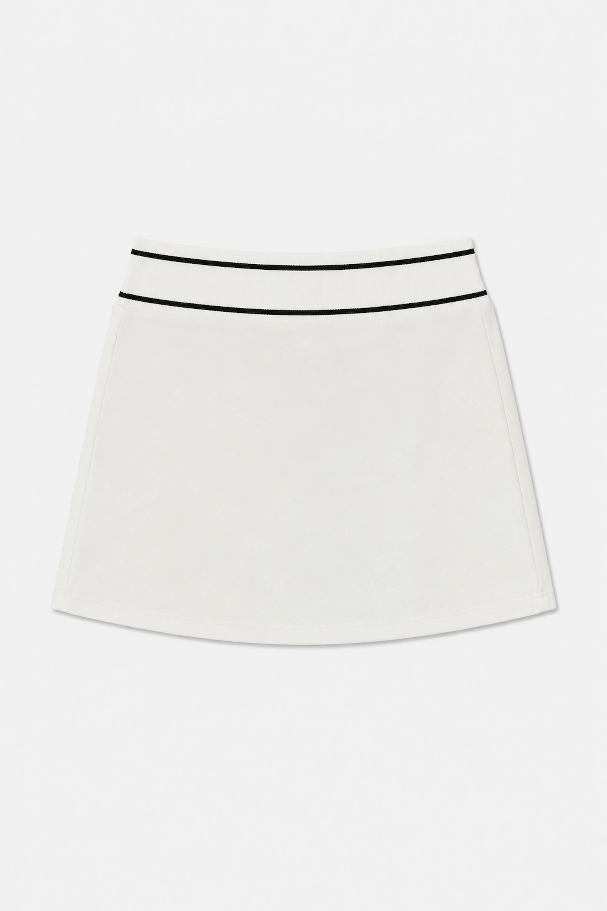 Front flat lay of women’s Soft Ivory classic golf skort featuring contrast black trim at the waistband
