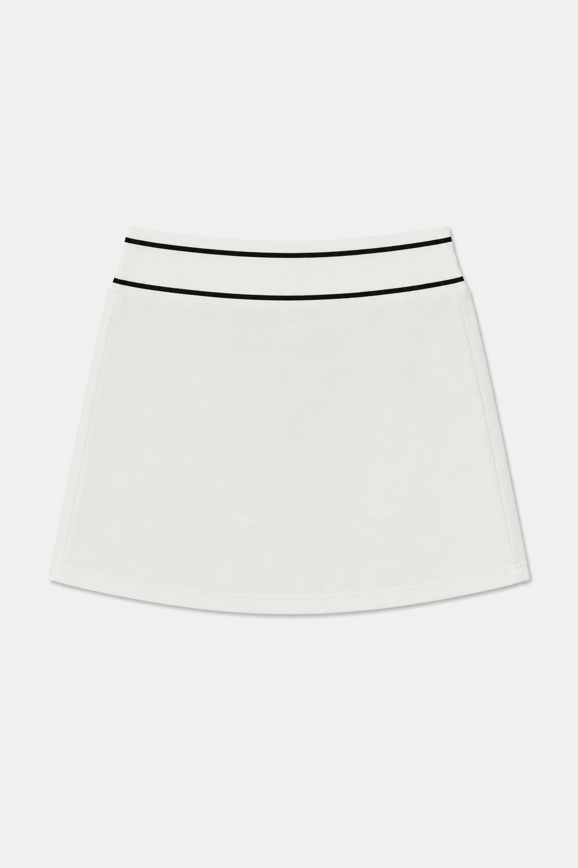 Front flat lay of VEZA women’s Soft Ivory classic golf skort featuring contrast black trim at the waistband