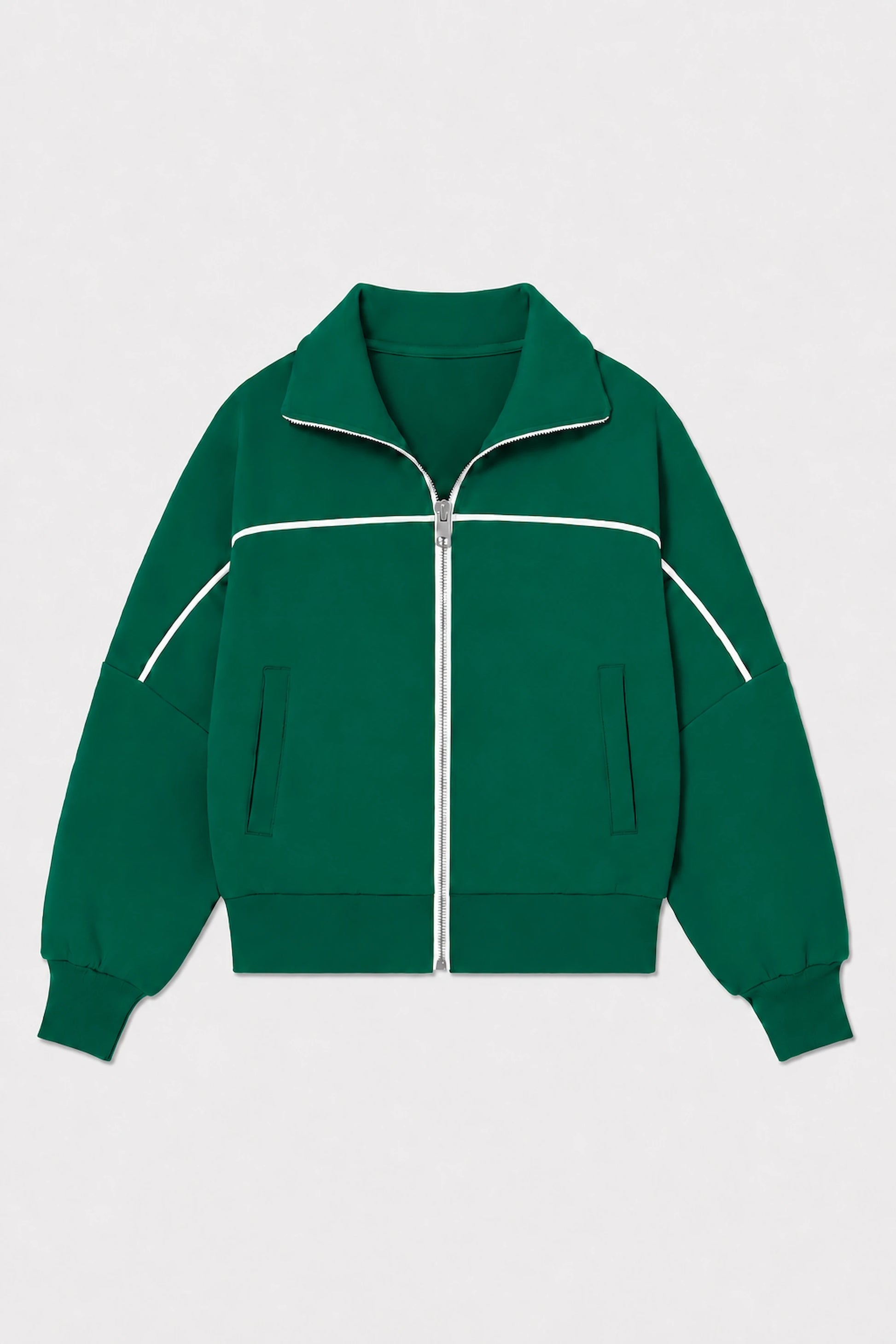 Front flat lay of women’s Deep Teal cropped golf jacket featuring contrast white piping, full-zip front, and side pockets