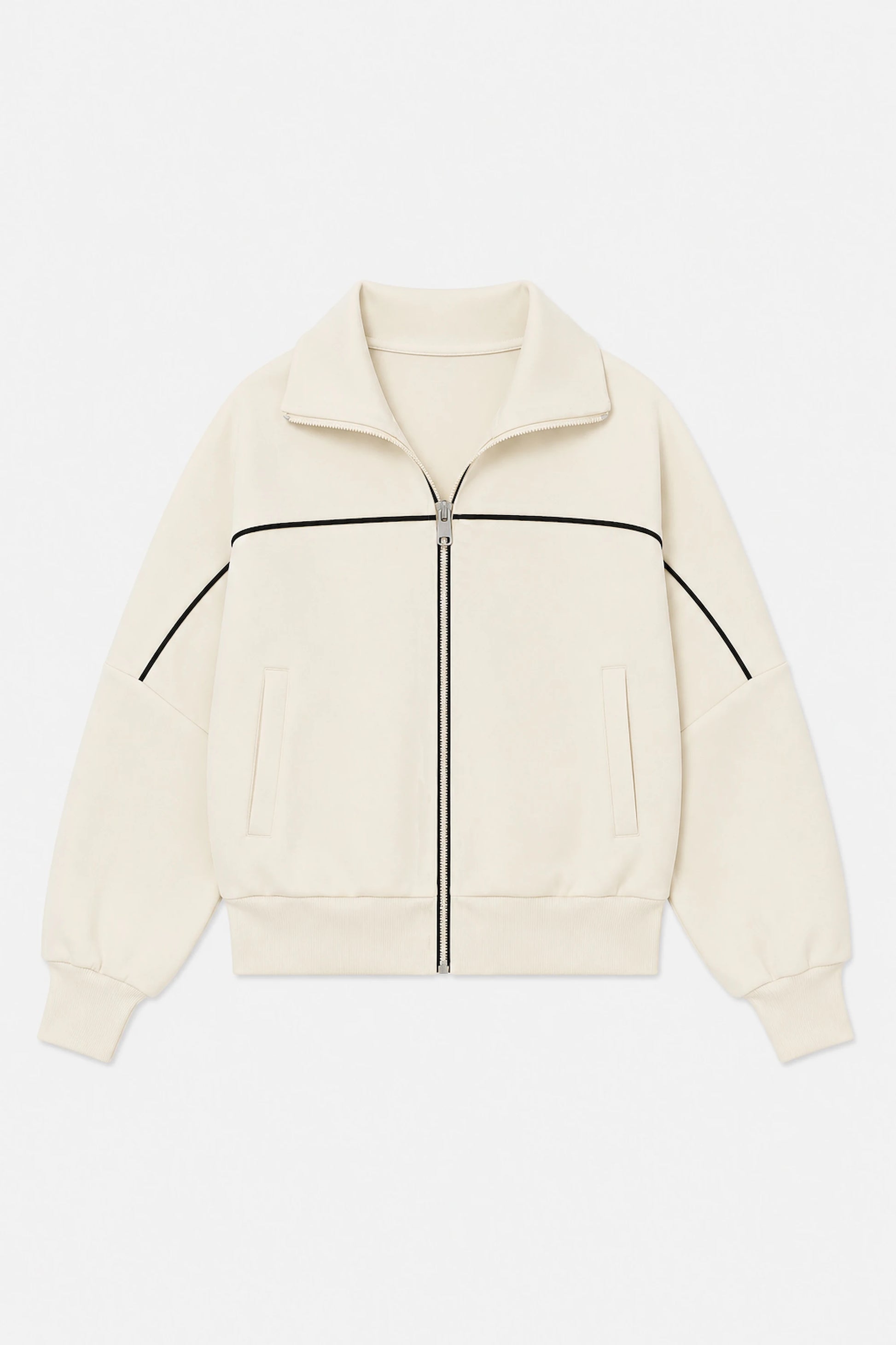 Front flat lay of women’s Soft Ivory cropped golf jacket featuring contrast black piping, full-zip front, and side pockets