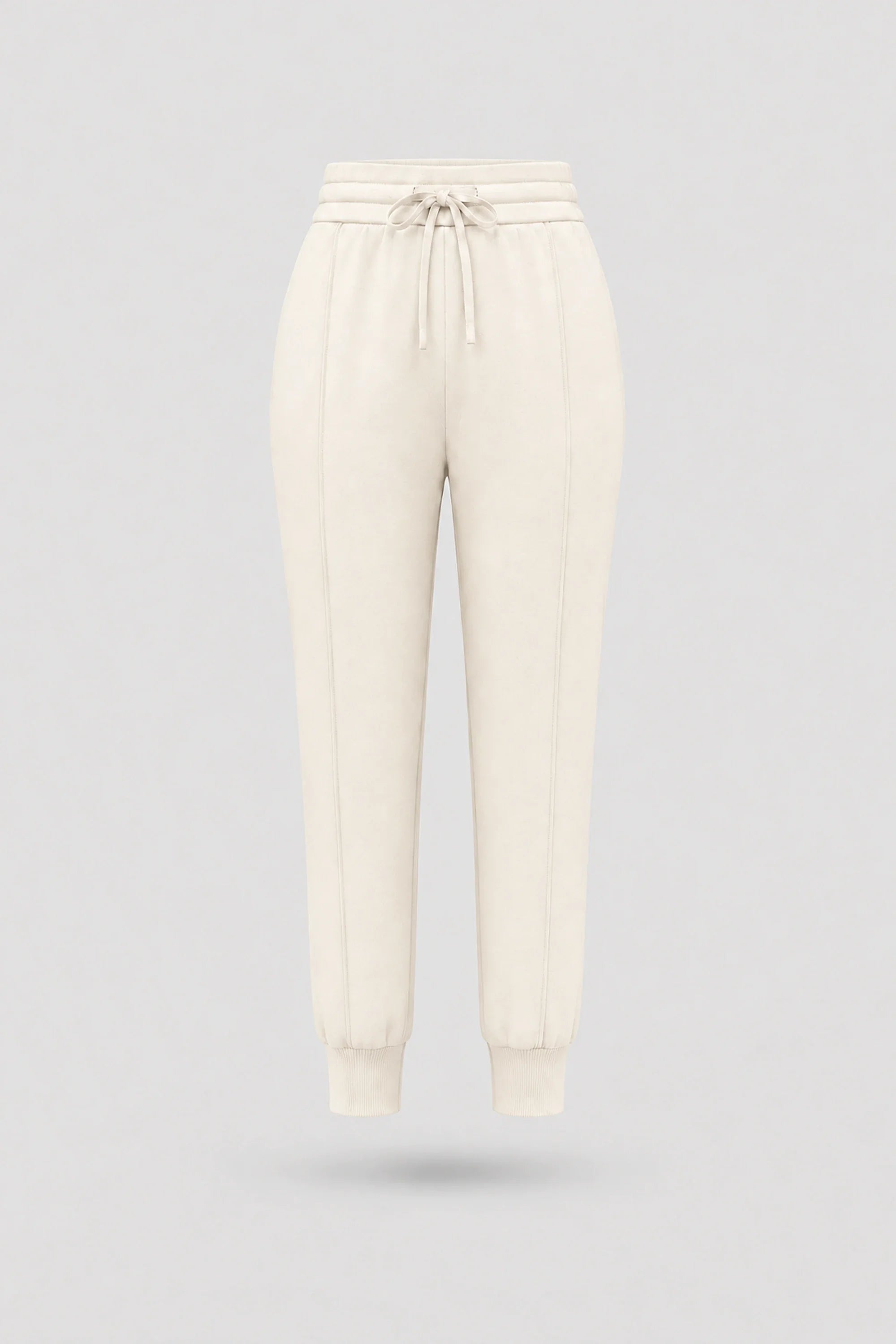 Women's Ivory drawstring jogger pants with relaxed silhouette, ribbed cuffs, and soft stretch fabric