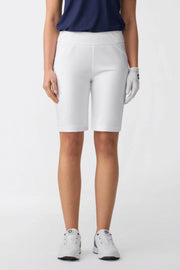 Front view of women’s tailored golf shorts in cloudline white with a smooth pull-on waistband and streamlined fit