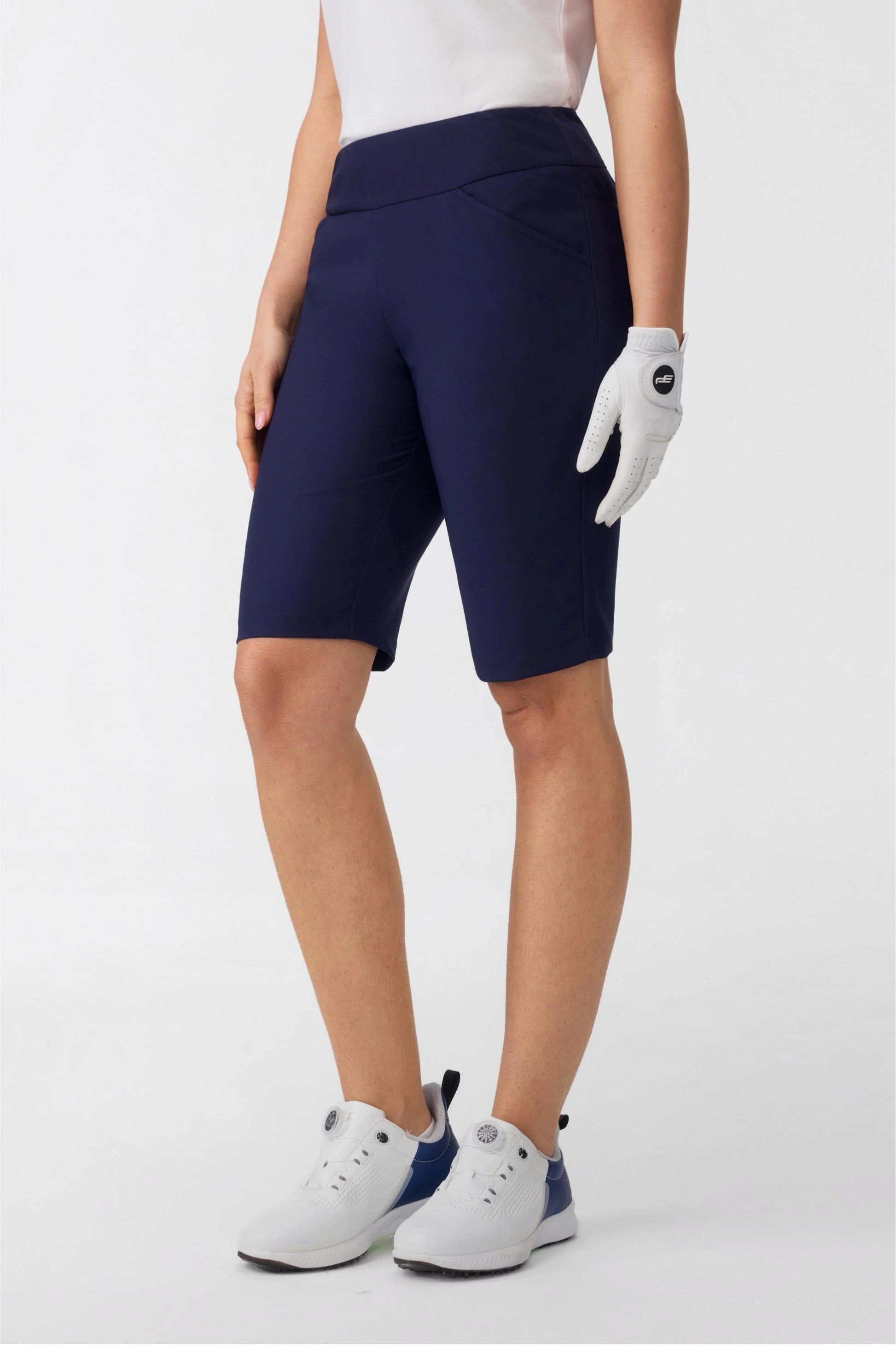 Side view of women’s midnight navy tailored golf shorts with sleek tailored fit for golf performance