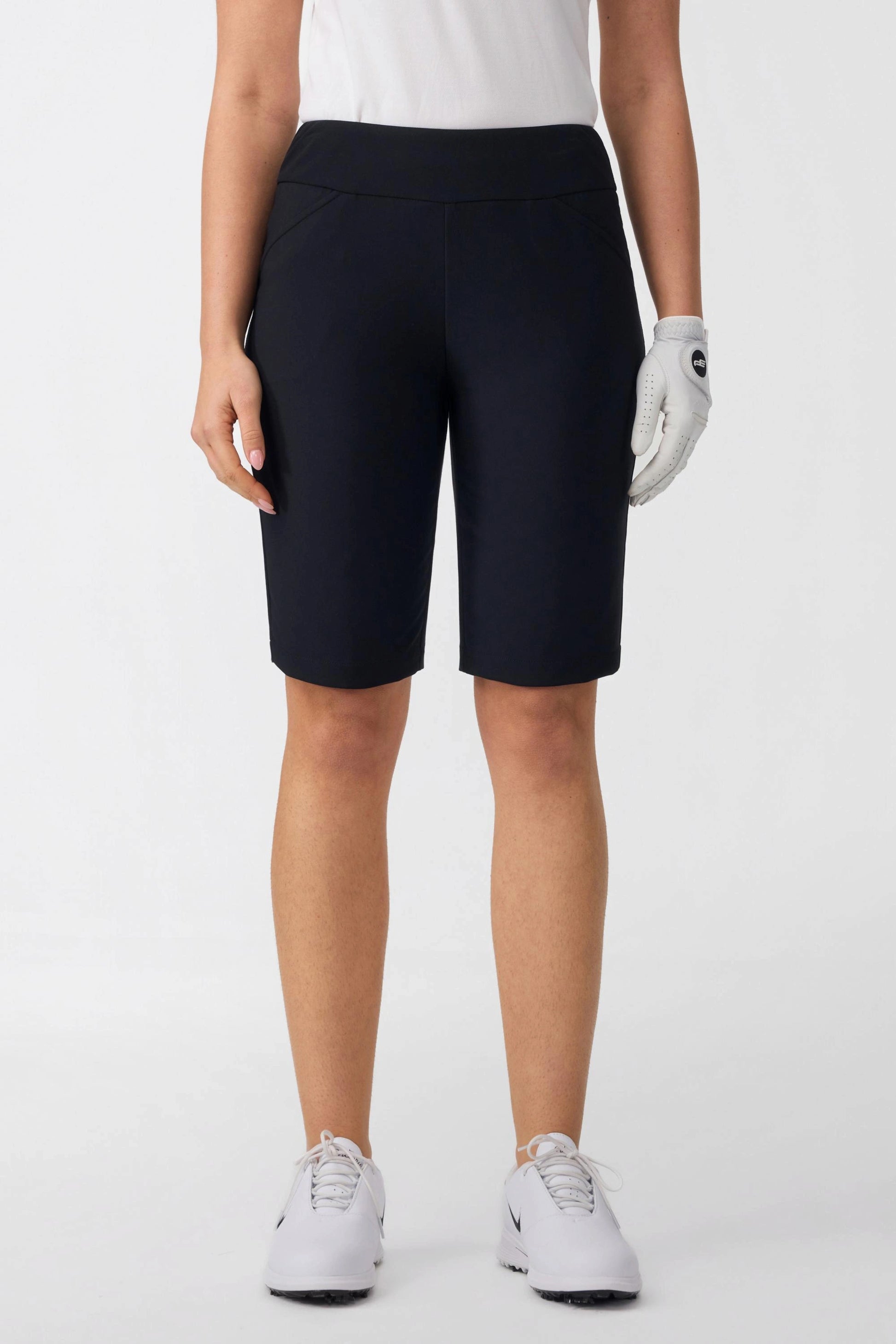 Front view of women’s onyx black tailored golf shorts with smooth waistband and performance stretch fabric
