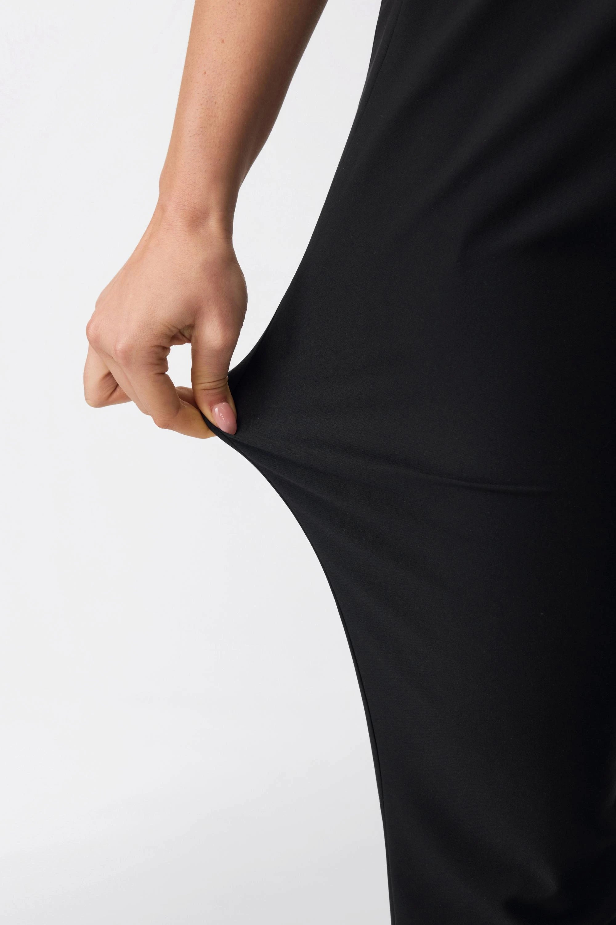 Close-up of stretch performance fabric on women’s onyx black tailored golf shorts