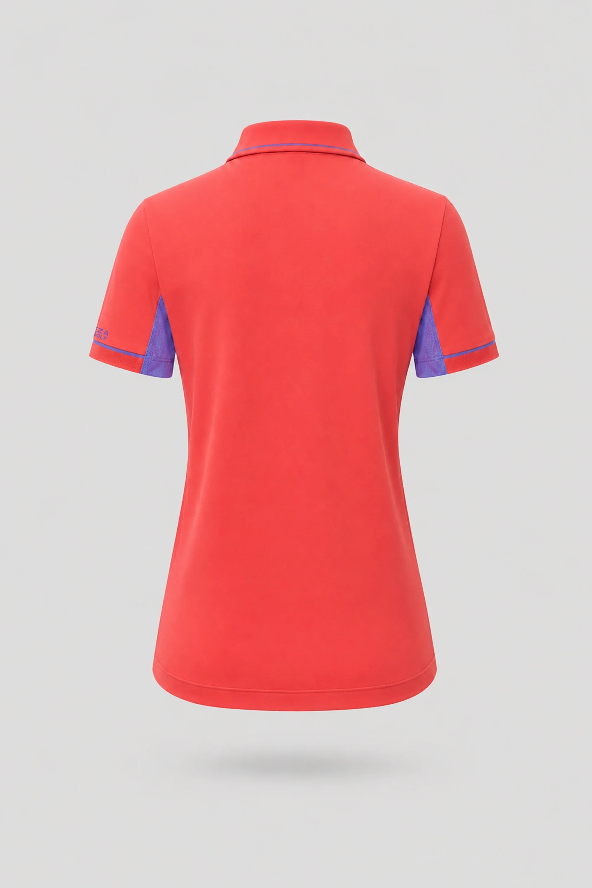 Back view of women's coral red golf polo with breathable mesh sleeve panels and athletic fit