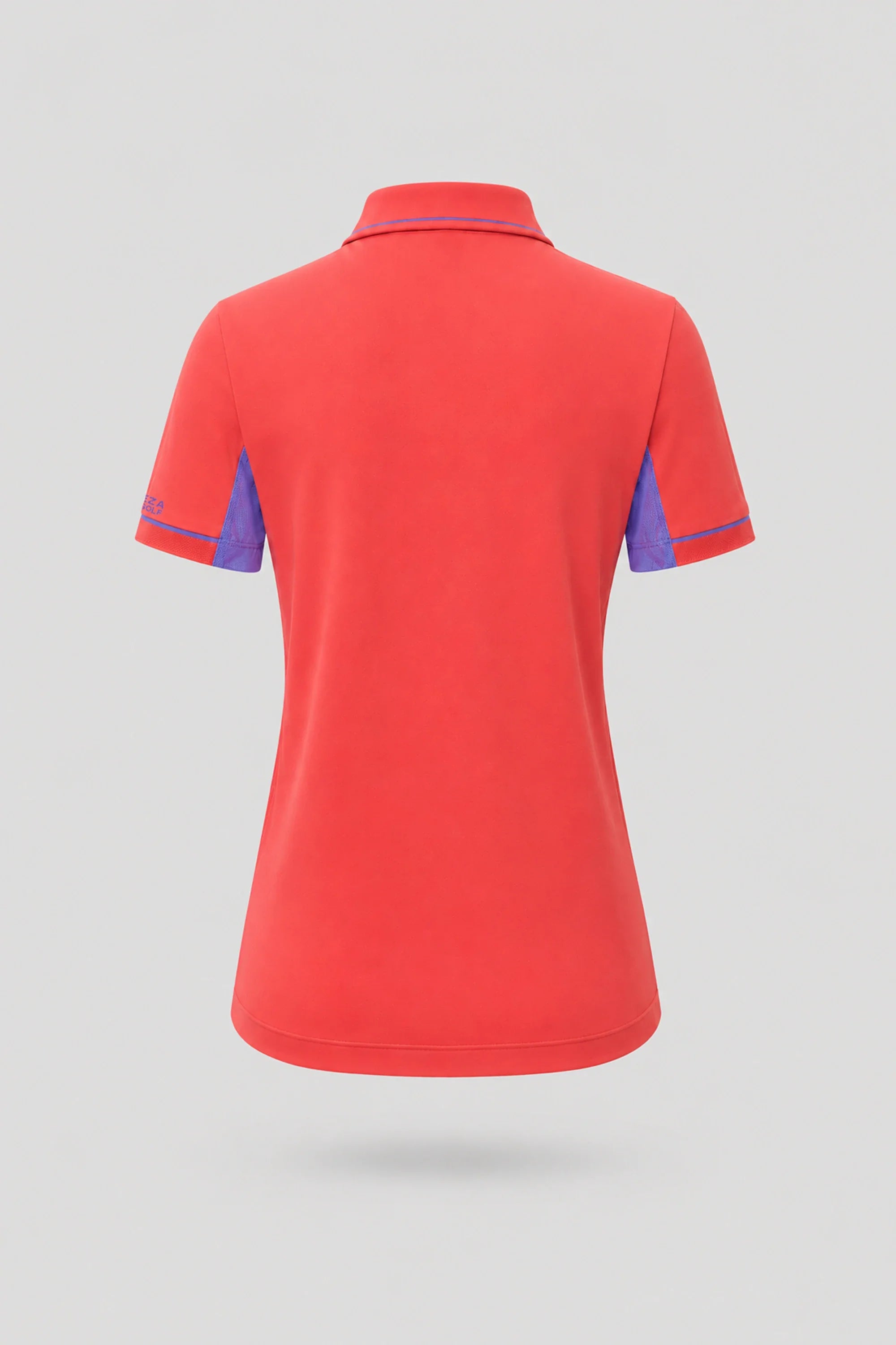 Back view of women's coral red golf polo with breathable mesh sleeve panels and athletic fit