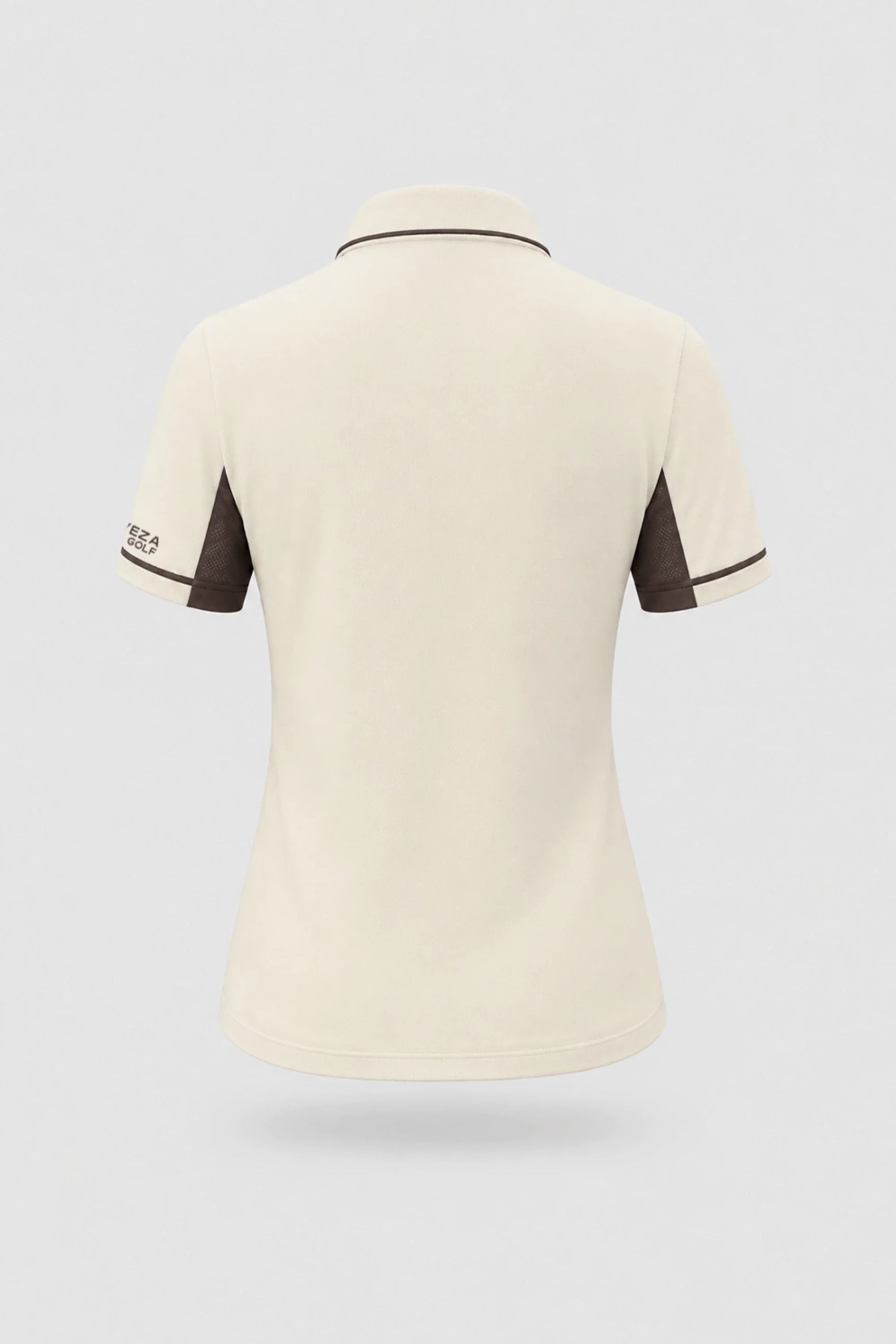 Back view of women's Cream golf polo with clean minimalist design and stretch performance fabric