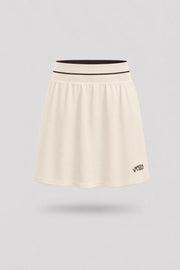 Women's Cream golf skort with A-line silhouette and comfortable wide waistband