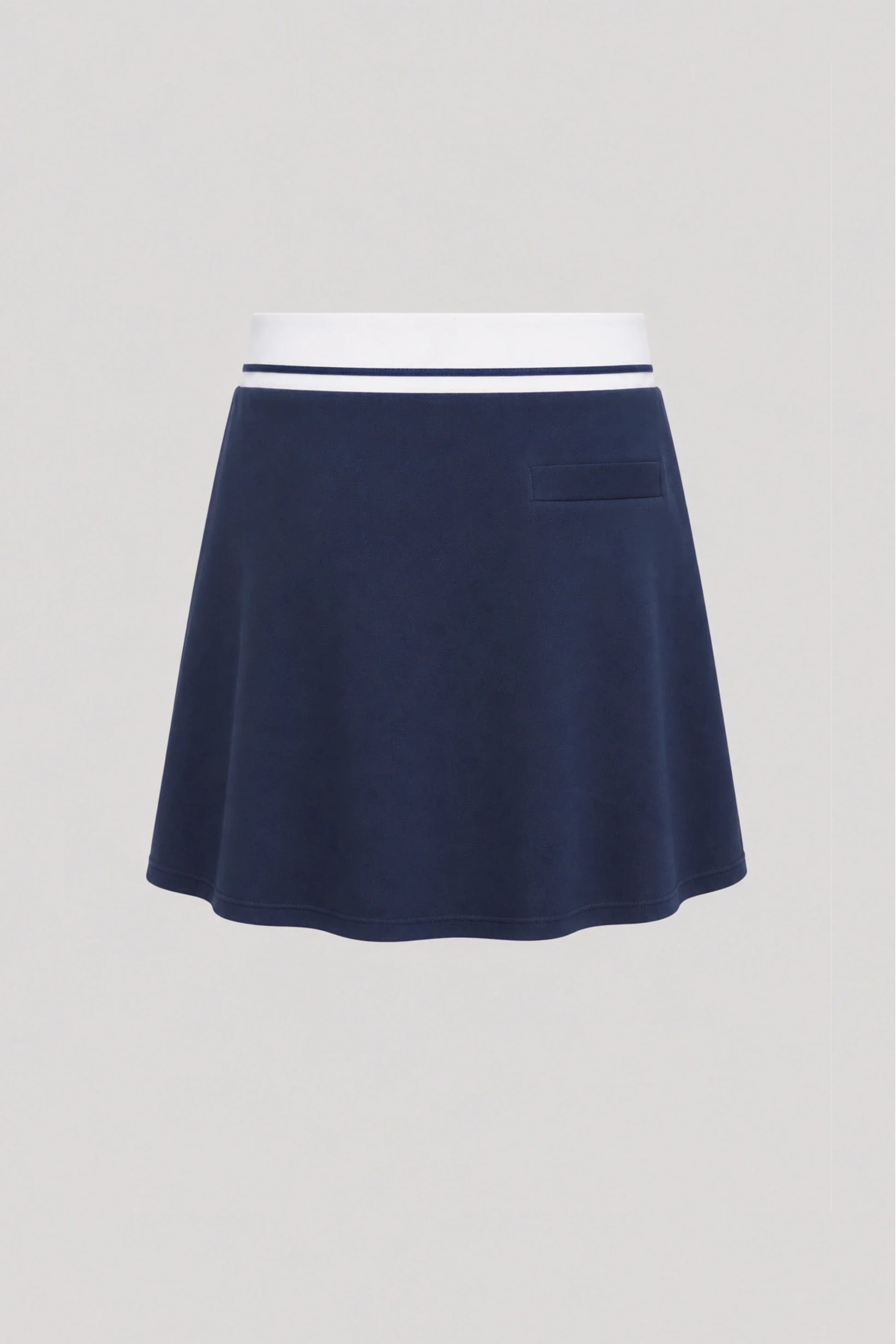 Back view of women's midnight navy golf skort with lightweight stretch fabric and athletic fit