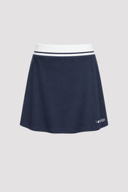 Women's midnight navy golf skort with A-line silhouette and comfortable wide waistband