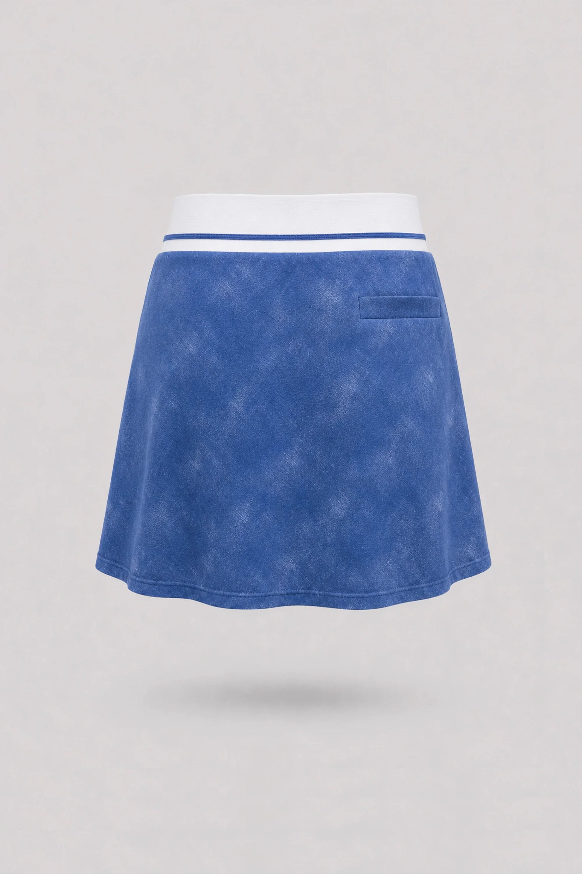 Back view of women's vintage blue golf skort with lightweight stretch performance fabric and athletic fit
