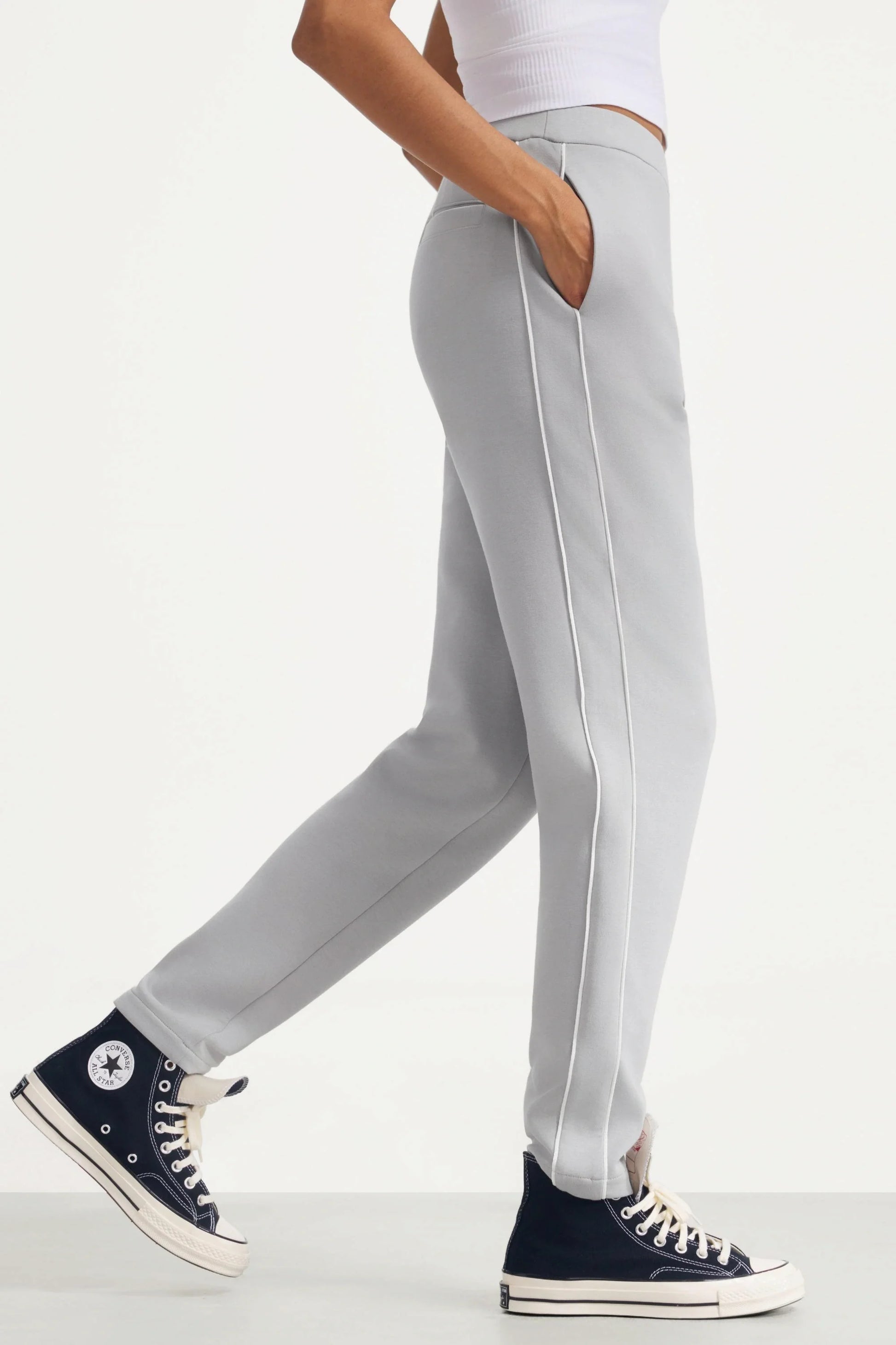 Side view of women's Soft Cloud Grey slim fit golf pants with contrast piping and side pocket