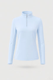 Women’s long sleeve zip neck golf top in Sky Mist light blue with a sleek performance design