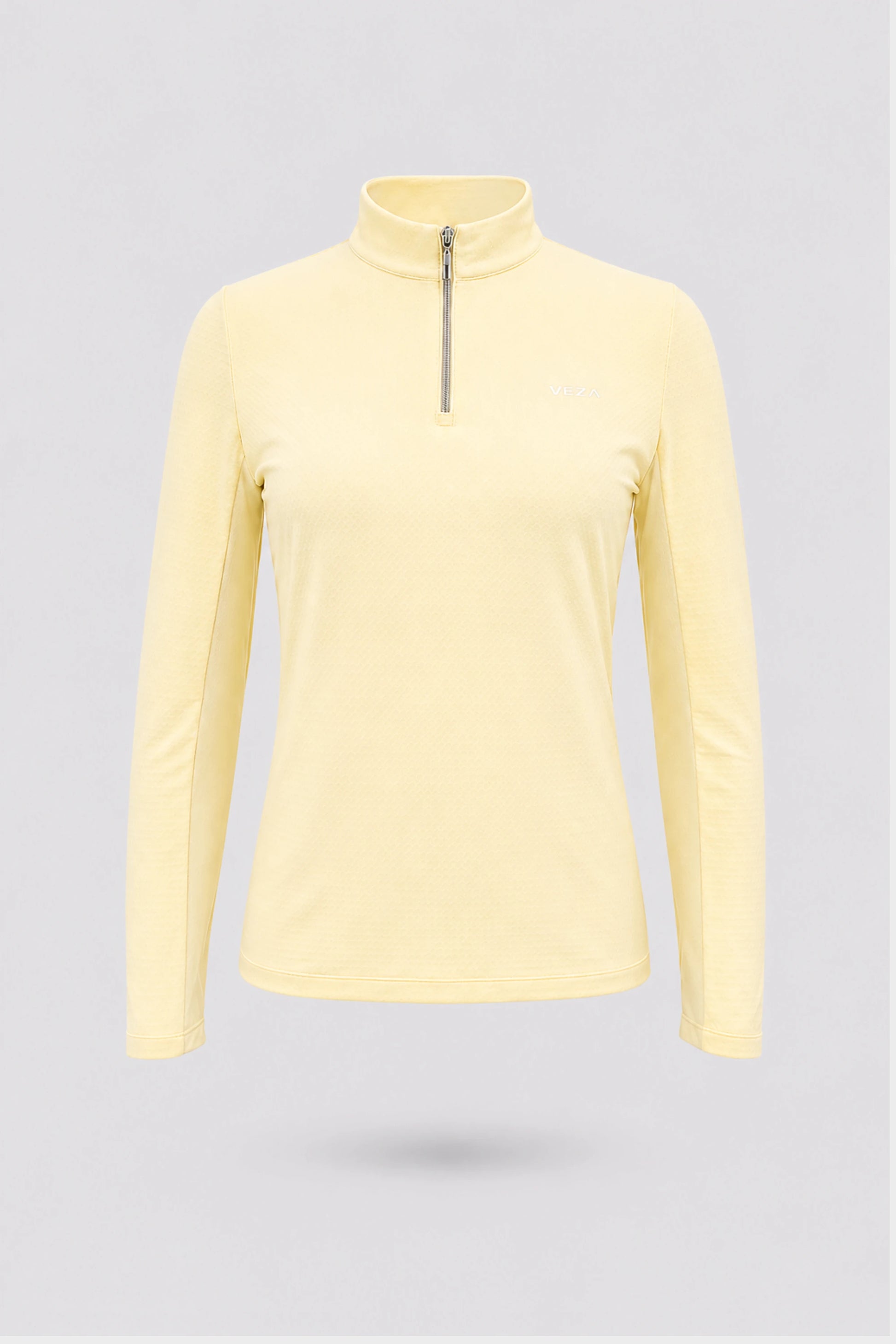 Women’s yellow long sleeve zip-neck golf top with breathable stretch fabric and UV protection front view