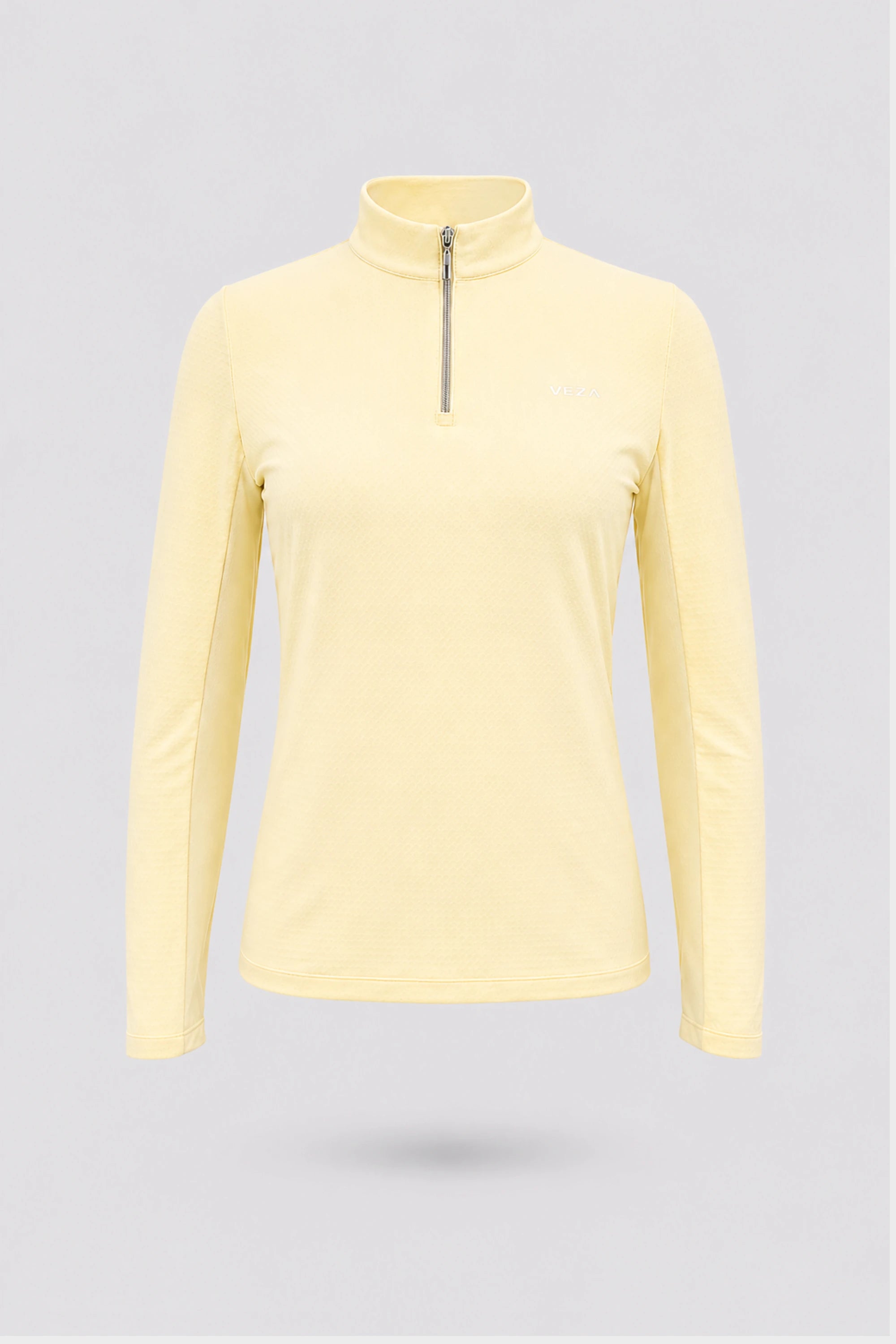 Women’s yellow long sleeve zip-neck golf top with breathable stretch fabric and UV protection front view