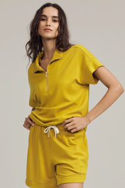 Women’s marigold performance quarter-zip top paired with matching relaxed shorts