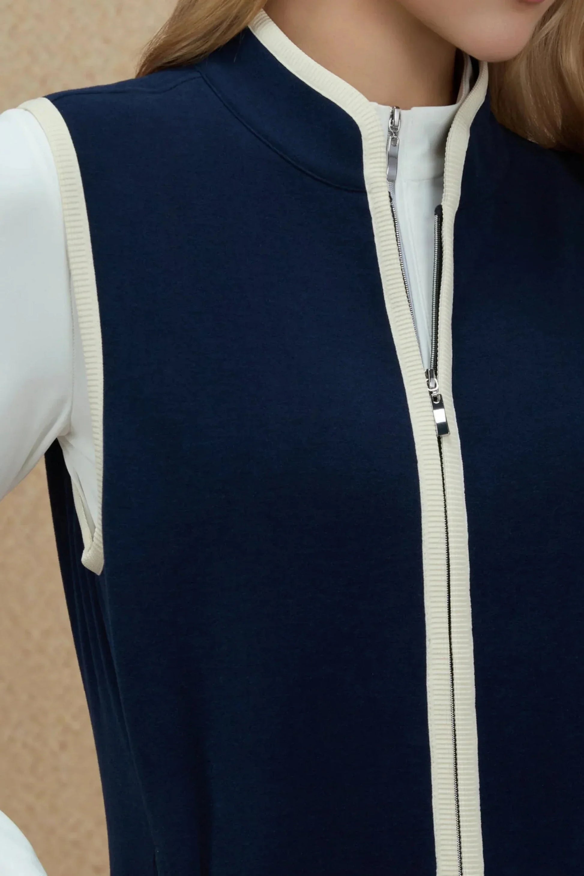 Close-up of zipper and contrast trim detail on Women’s Midnight Navy golf vest
