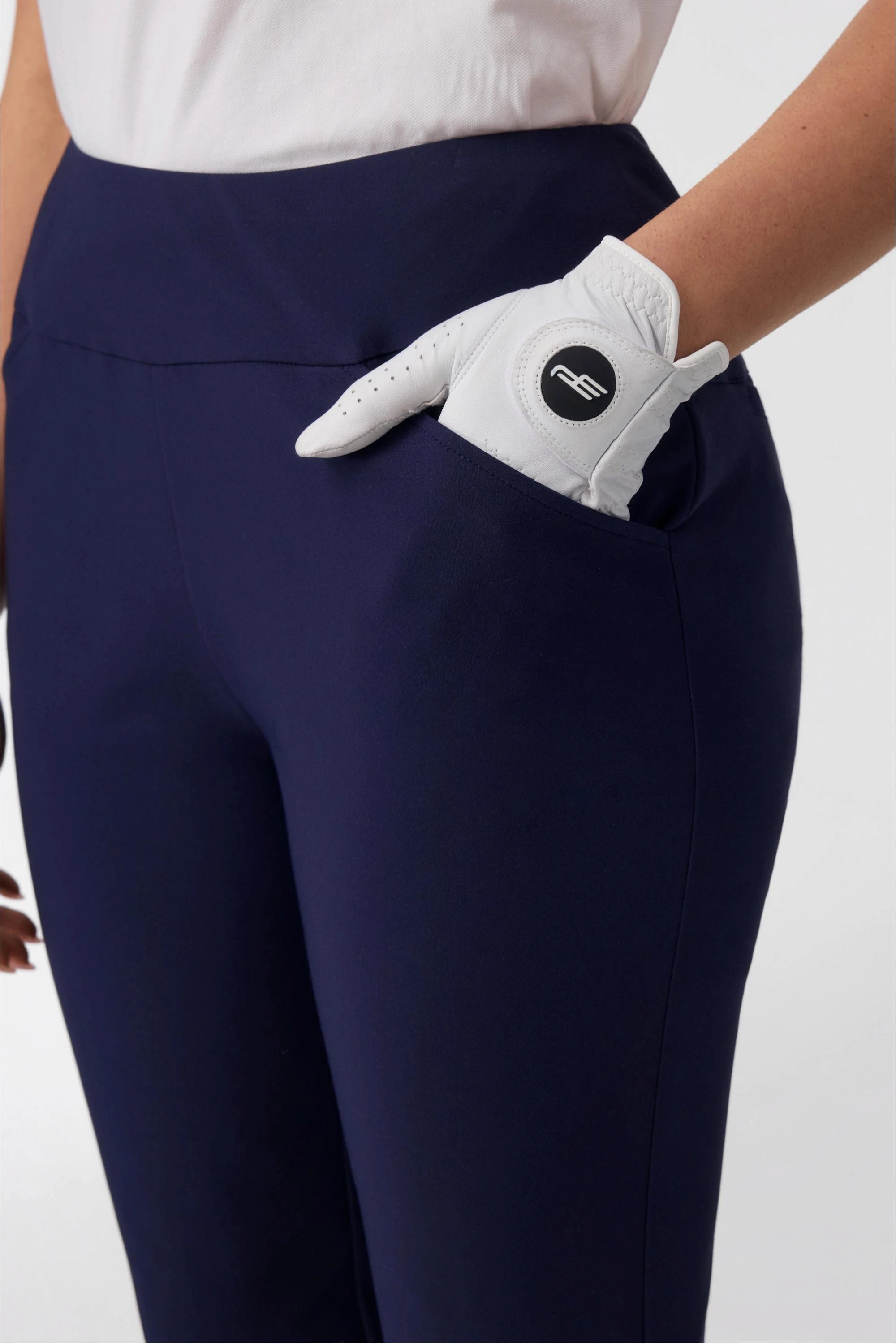Close-up of pocket detail on women’s midnight navy tapered golf pants