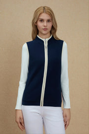 Front view of Women’s Midnight Navy zip-front golf vest with stand collar and contrast trim