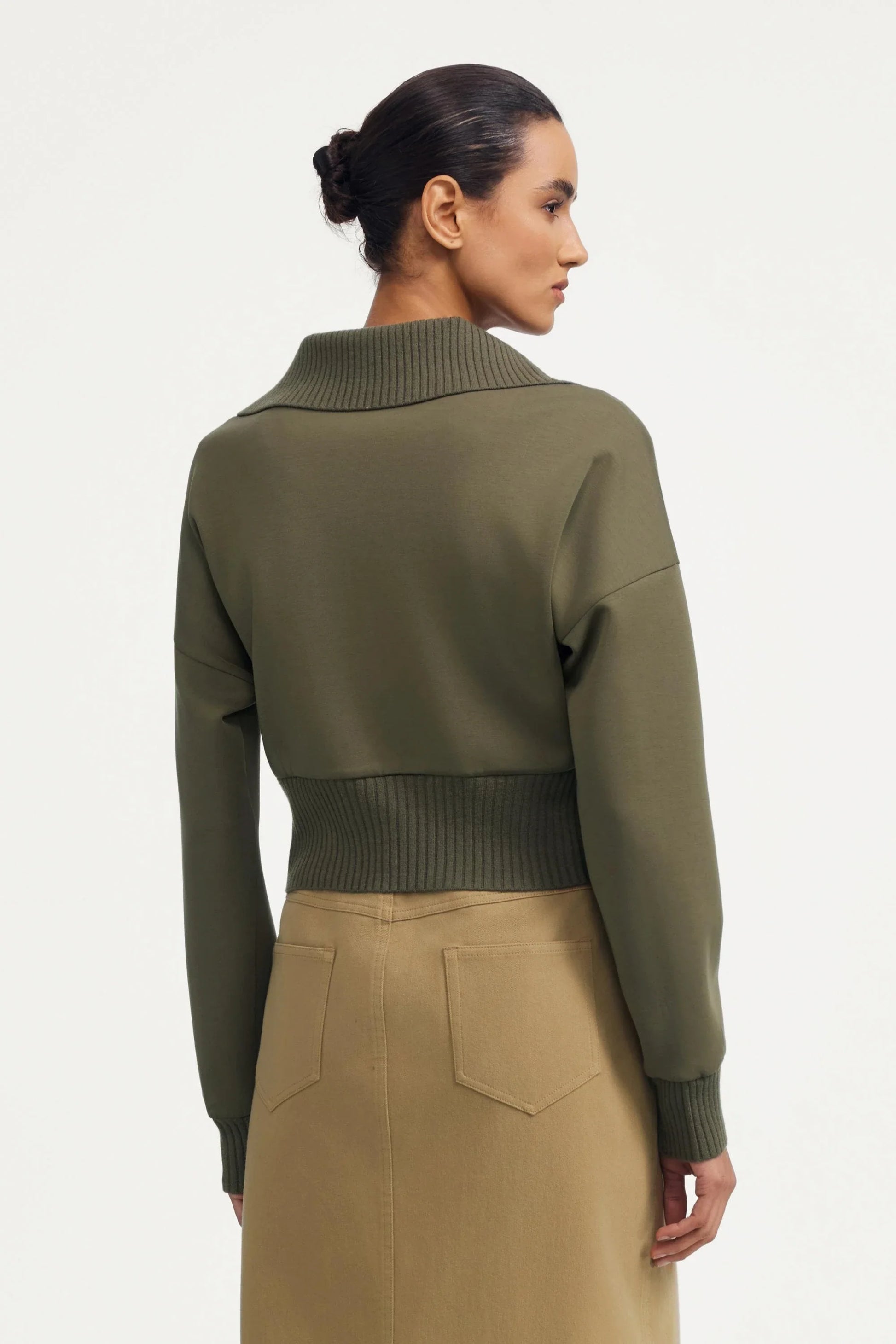 Back view of women’s olive taupe cropped knit zip jacket with ribbed hem