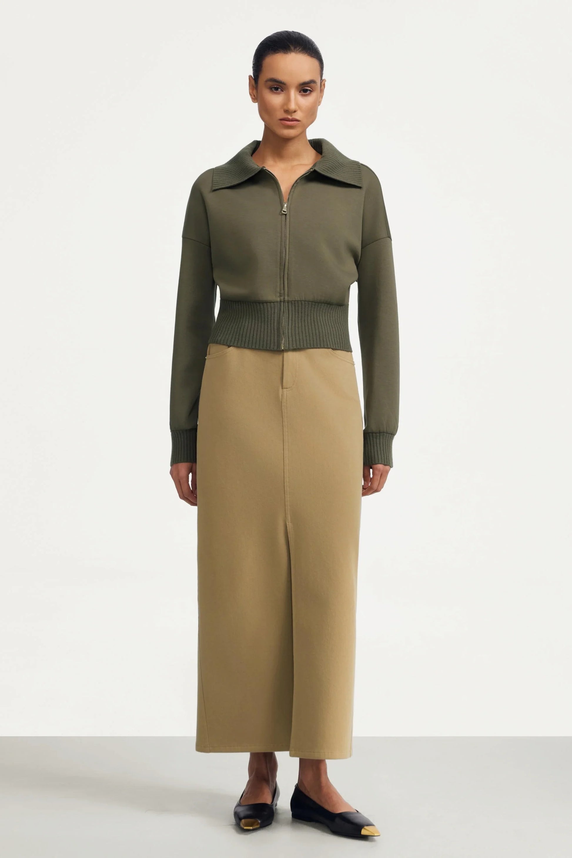 Women’s olive taupe cropped knit zip jacket paired with beige maxi skirt