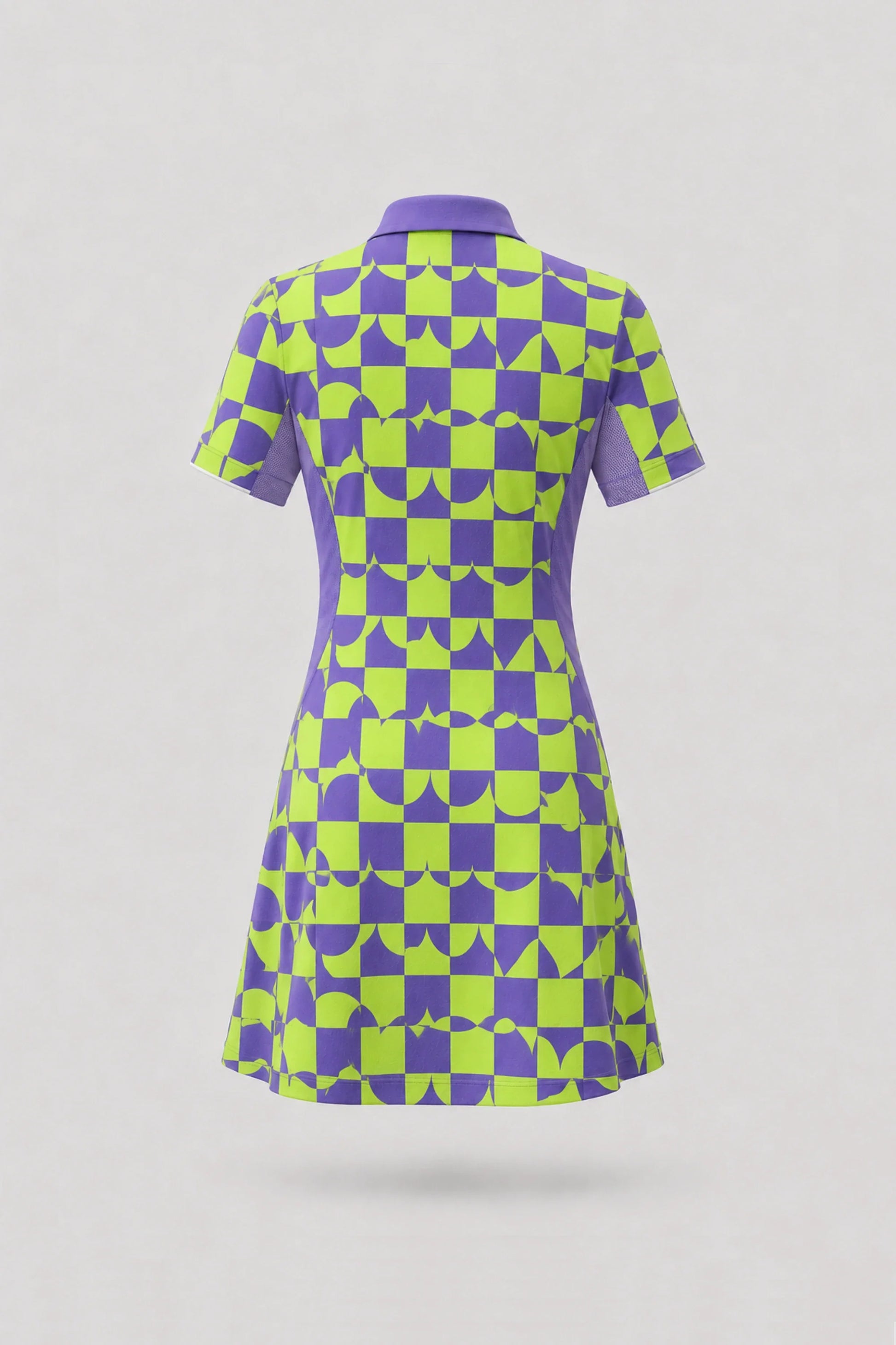 Back view of women's patterned golf dress featuring Paradox Geo design with breathable mesh sleeve panels and athletic fit